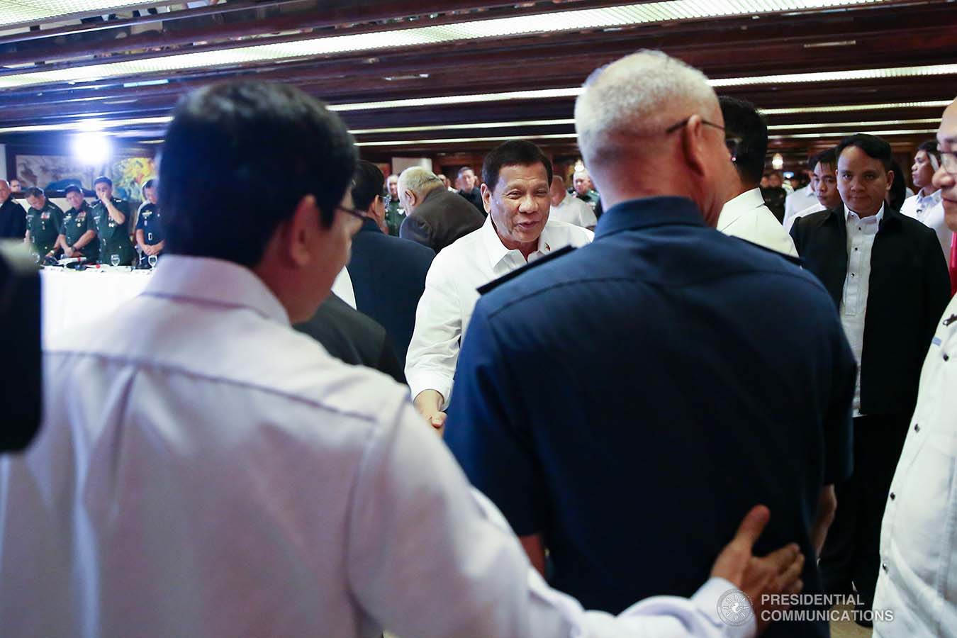 President Rodrigo Roa Duterte shares a light moment with some officials from the security sector during the Joint Armed Forces of the Philippines-Philippine National Police (AFP-PNP) Command Conference at the Malacañan Palace on September 5, 2019. REY BANIQUET/PRESIDENTIAL PHOTO
