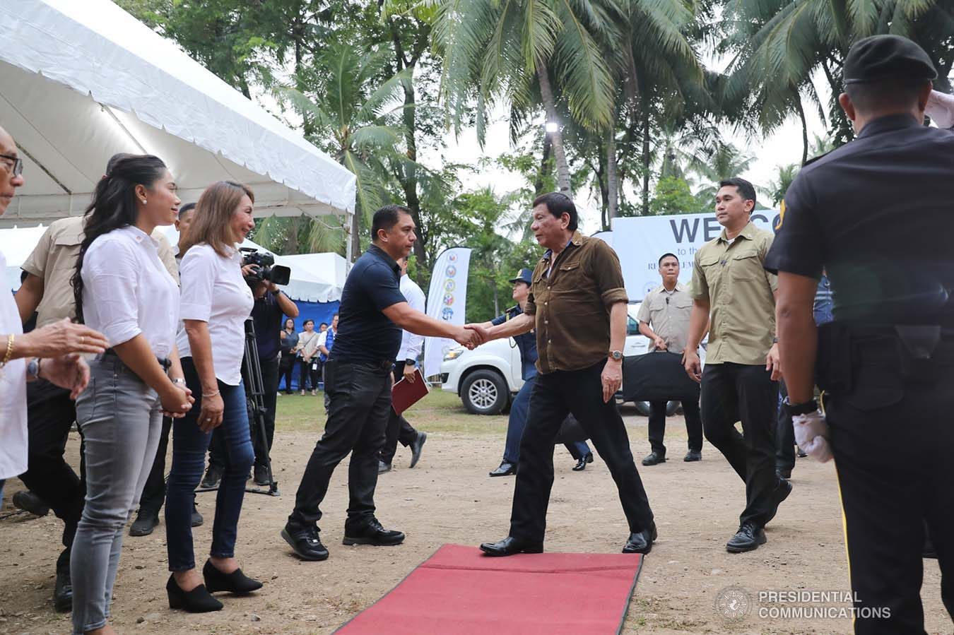 President Rodrigo Roa Duterte is welcomed by National Housing Authority General Manager Marcelino Escalada Jr. upon his arrival to lead the groundbreaking ceremony and time capsule laying of the Naga Permanent Housing Project in Naga City, Cebu on September 6, 2019. ALFRED FRIAS/ PRESIDENTIAL PHOTO
