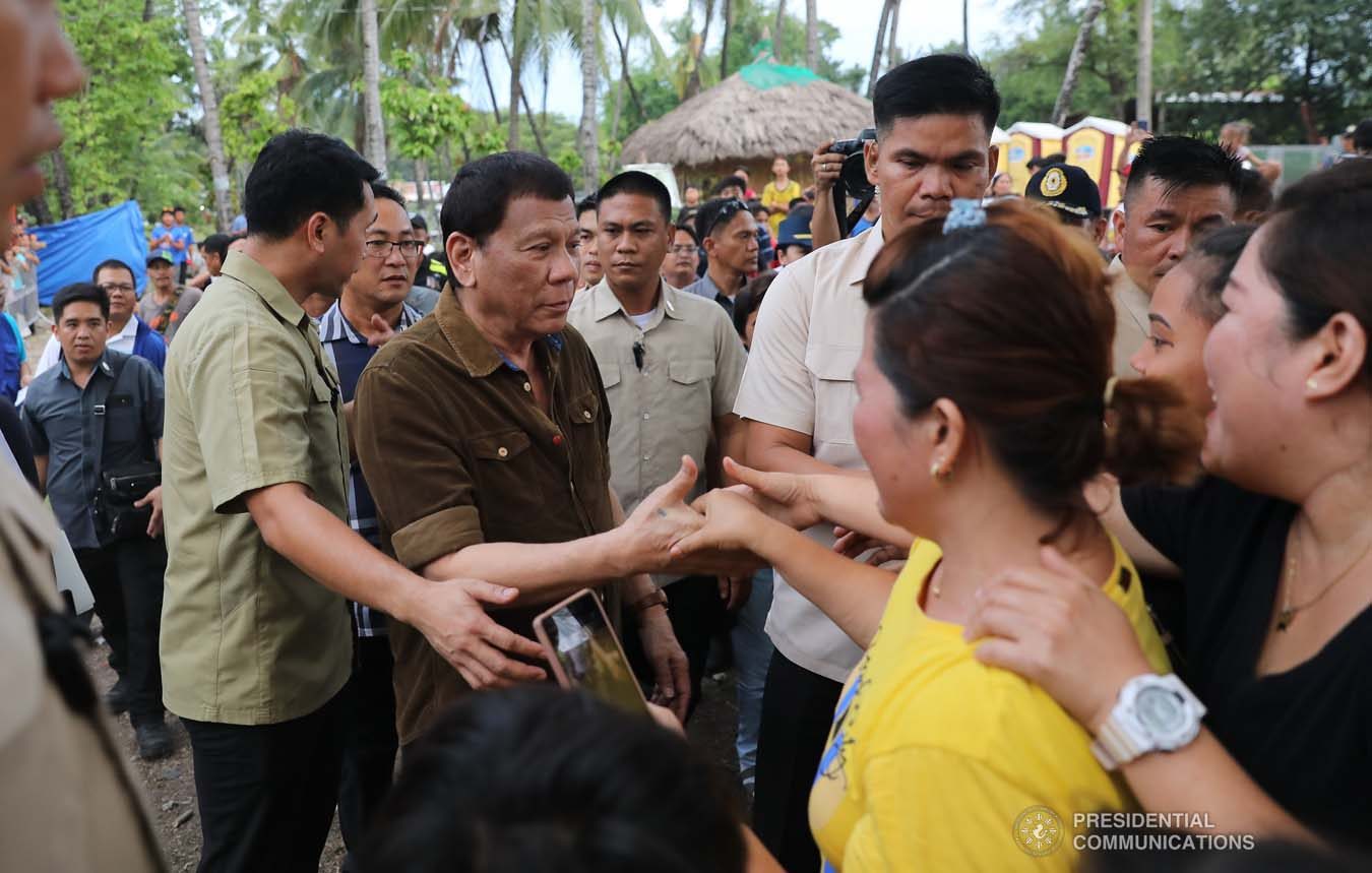President Rodrigo Roa Duterte interacts with the attendees during the groundbreaking ceremony for the Naga Permanent Housing Project in Naga City, Cebu on September 6, 2019. ALFRED FRIAS/ PRESIDENTIAL PHOTO