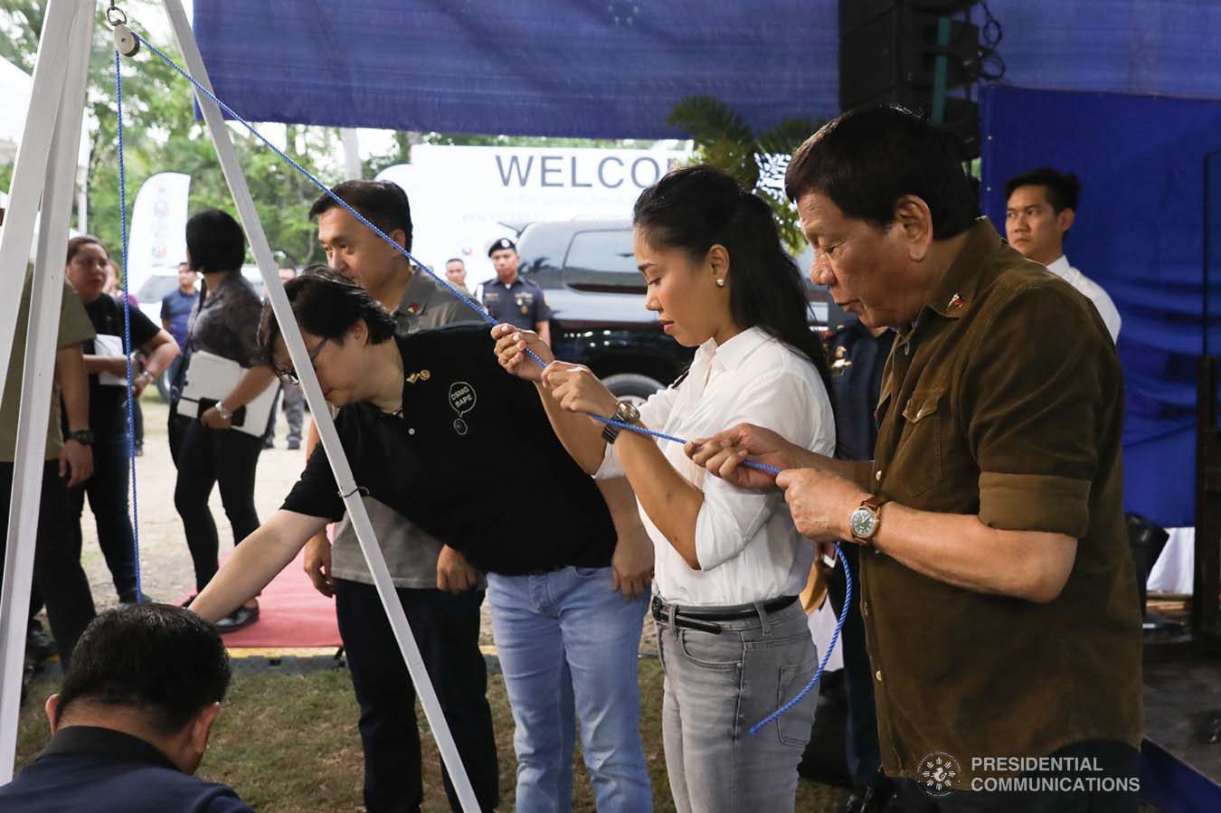 President Rodrigo Roa Duterte lays in the time capsule as he leads the groundbreaking ceremony for the Naga Permanent Housing Project in Naga City, Cebu on September 6, 2019. Assisting the President are Senator Christopher "Bong" Go, Presidential Assistant for the Visayas Michael Dino, Naga City Acting Mayor Kristine Vanessa Chiong, and National Housing Authority General Manager Marcelino Escalada Jr. TOTO LOZANO/ PRESIDENTIAL PHOTO