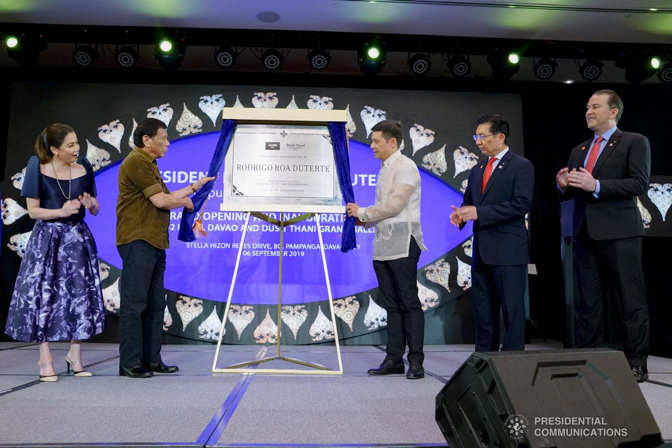 President Rodrigo Roa Duterte leads the unveiling of the marker of the Dusit D2 Davao Hotel during its inauguration in Davao City on September 6, 2019. Assisting the President are Tourism Secretary Bernadette Romulo-Puyat, Torre Lorenzo Development Corporation (TLDC) CEO Tomas Lorenzo, Dusit International COO Boon Kwee Lim, and dusitD2 Davao Hotel and Dusit Thani Residence Davao General Manager Christopher Wichlan. JOEY DALUMPINES/PRESIDENTIAL PHOTO