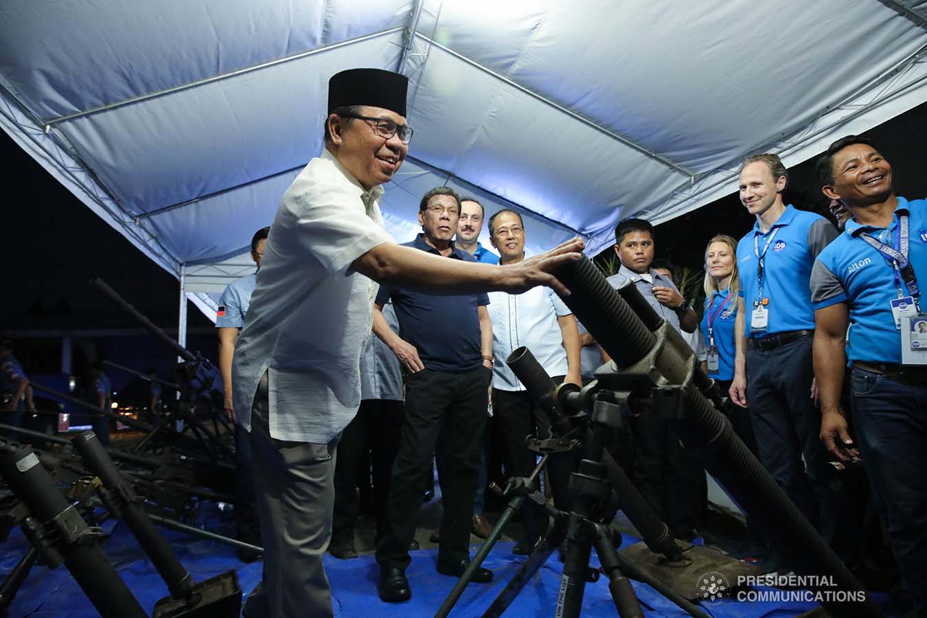 President Rodrigo Roa Duterte looks on as Bangsamoro Autonomous Region in Muslim Mindanao (BARMM) Interim Chief Minister Al Haj Murad Ebrahim inspects the decommissioned firearms from the former combatants of the Moro Islamic Liberation Front during their decommissioning at the Old Provincial Capitol Compound in Sultan Kudarat, Maguindanao on September 7, 2019. ROBINSON NIÑAL JR./PRESIDENTIAL PHOTO