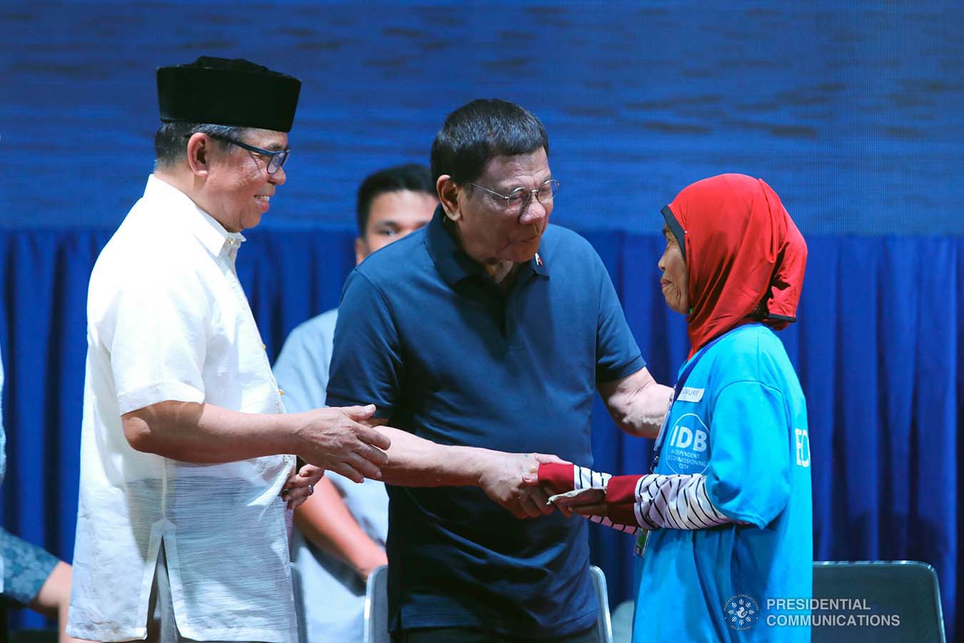 President Rodrigo Roa Duterte leads the distribution of socio-economic assistance to the former combatants of the Moro Islamic Liberation Front during their decommissioning at the Old Provincial Capitol Compound in Sultan Kudarat, Maguindanao on September 7, 2019. Assisting the President is Bangsamoro Autonomous Region in Muslim Mindanao (BARMM) Interim Chief Minister Al Haj Murad Ebrahim. ROBINSON NIÑAL JR./PRESIDENTIAL PHOTO