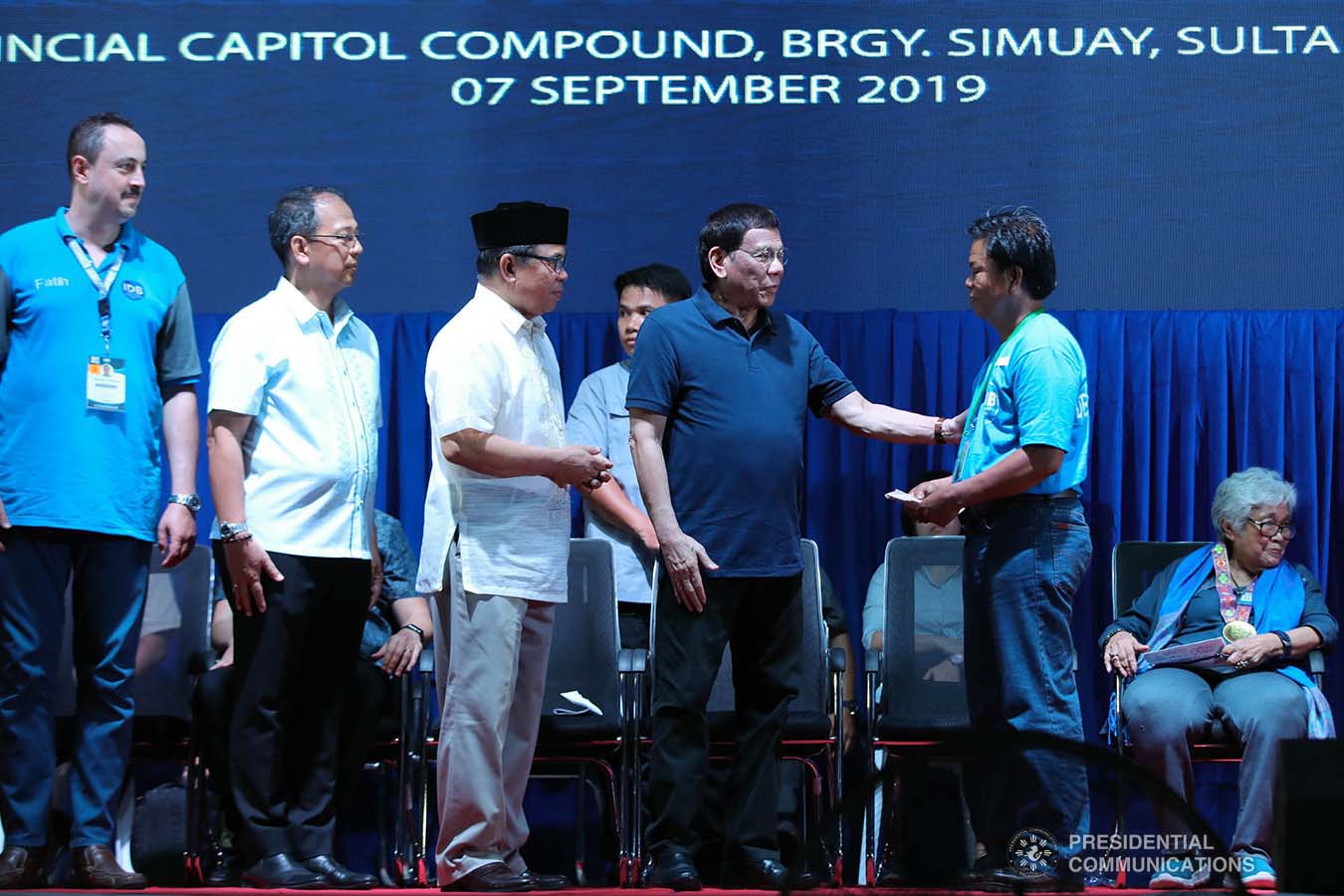 President Rodrigo Roa Duterte leads the distribution of socio-economic assistance to the former combatants of the Moro Islamic Liberation Front during their decommissioning at the Old Provincial Capitol Compound in Sultan Kudarat, Maguindanao on September 7, 2019. Assisting the President are Presidential Adviser on the Peace Process Carlito Galvez Jr. and Bangsamoro Autonomous Region in Muslim Mindanao (BARMM) Interim Chief Minister Al Haj Murad Ebrahim. ROBINSON NIÑAL JR./PRESIDENTIAL PHOTO