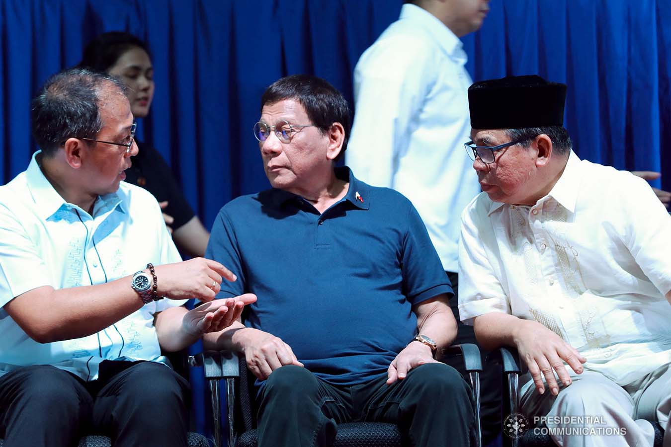 President Rodrigo Roa Duterte chats with Presidential Adviser on the Peace Process Carlito Galvez Jr. and Bangsamoro Autonomous Region in Muslim Mindanao (BARMM) Interim Chief Minister Al Haj Murad Ebrahim during the launch of the second phase of the decommissioning of Moro Islamic Liberation Front combatants and weapons at the Old Provincial Capitol Compound in Sultan Kudarat, Maguindanao on September 7, 2019. ROBINSON NIÑAL JR./PRESIDENTIAL PHOTO