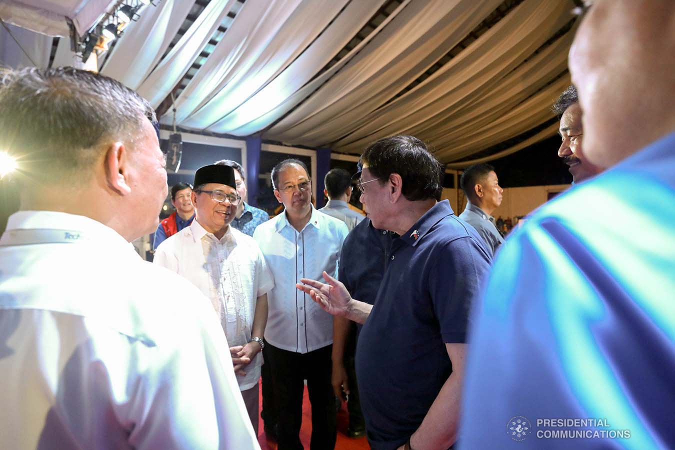 President Rodrigo Roa Duterte chats with Bangsamoro Autonomous Region in Muslim Mindanao (BARMM) Interim Chief Minister Al Haj Murad Ebrahim and Presidential Adviser on the Peace Process Carlito Galvez Jr. during the launch of the second phase of the decommissioning of Moro Islamic Liberation Front combatants and weapons at the Old Provincial Capitol Compound in Sultan Kudarat, Maguindanao on September 7, 2019. KARL NORMAN ALONZO/PRESIDENTIAL PHOTO