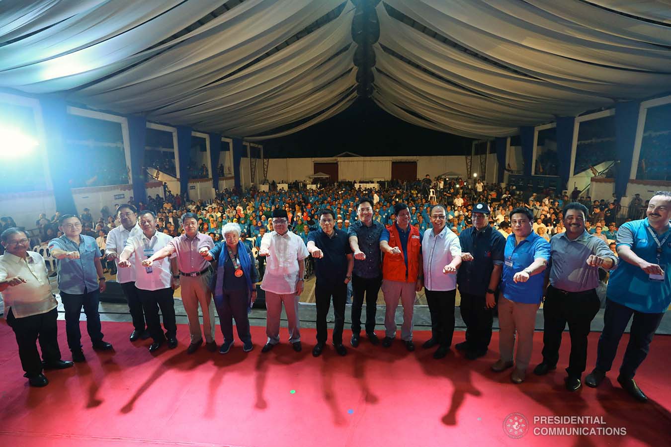 President Rodrigo Roa Duterte strikes his signature pose with the distinguished guests during the launch of the second phase of the decommissioning of Moro Islamic Liberation Front combatants and weapons at the Old Provincial Capitol Compound in Sultan Kudarat, Maguindanao on September 7, 2019. KARL NORMAN ALONZO/PRESIDENTIAL PHOTO