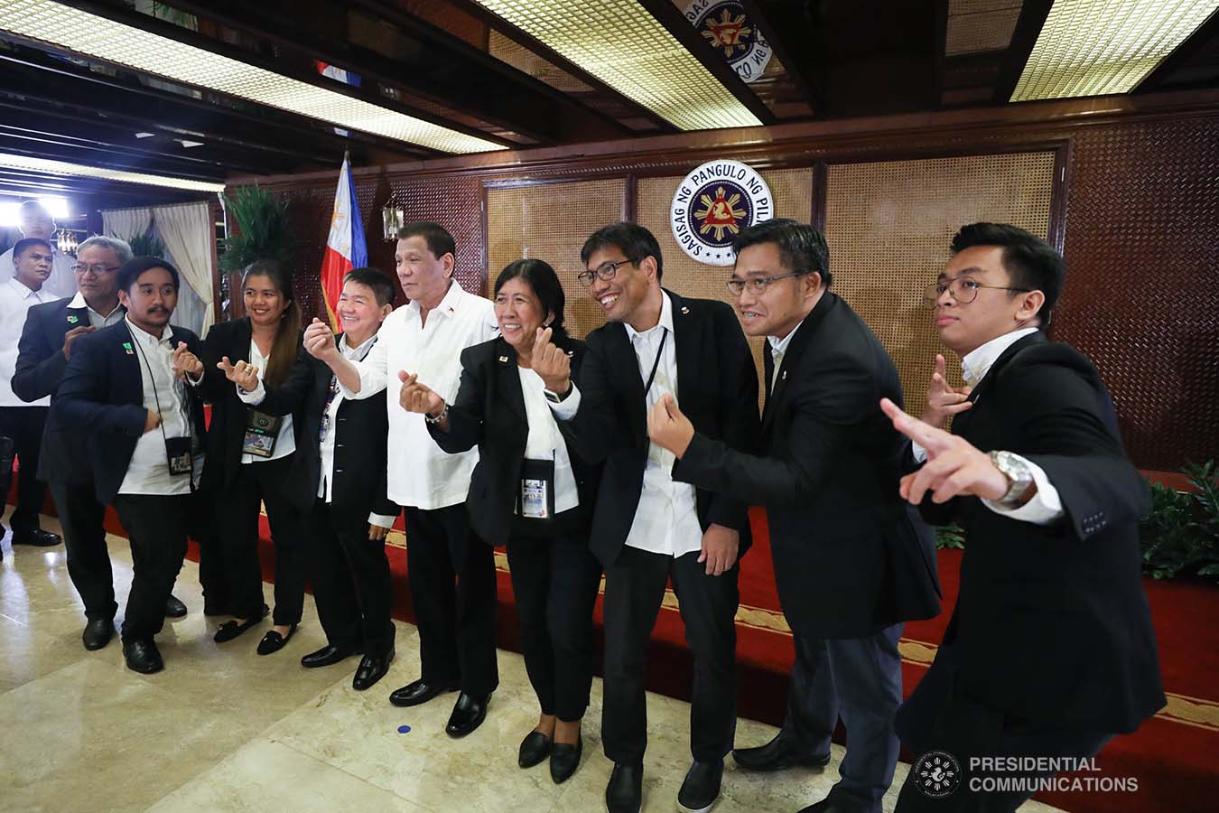 President Rodrigo Roa Duterte poses for posterity with the officers of the Presidential Photojournalists Association following their oath-taking ceremony at the Malacañan Palace on September 10, 2019. SIMEON CELI JR./PRESIDENTIAL PHOTO