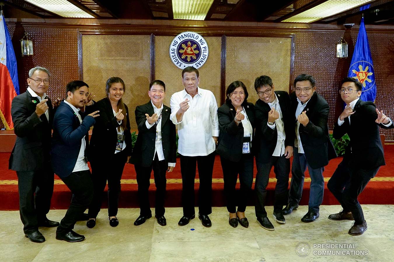 President Rodrigo Roa Duterte poses for posterity with the officers of the Presidential Photojournalists Association following their oath-taking ceremony at the Malacañan Palace on September 10, 2019. KING RODRIGUEZ/PRESIDENTIAL PHOTO