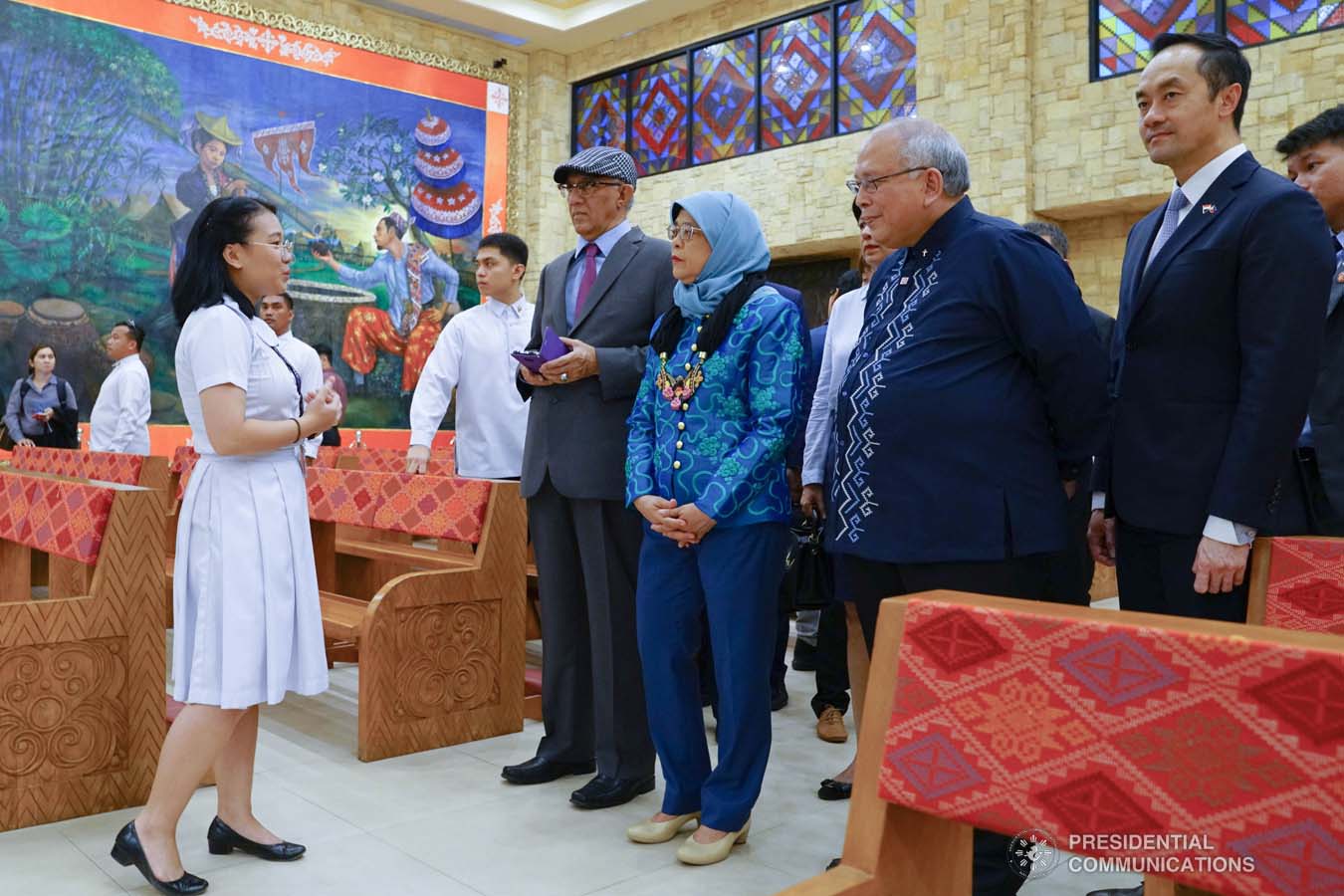 Republic of Singapore President Halimah Yacob receives a warm welcome from a pupil of the Ateneo de Davao University (ADDU) upon her arrival at the ADDU in Davao City on September 11, 2019. JOEY DALUMPINES/PRESIDENTIAL PHOTO