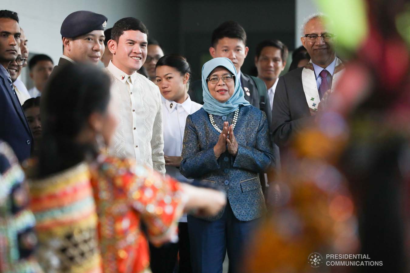 Republic of Singapore President Halimah Yacob admires the cultural performers who entertained her upon her arrival at the Davao International Airport in Davao City on September 10, 2019. Accompanying the Singaporean President is Davao City Vice Mayor Sebastian Duterte. KARL NORMAN ALONZO/PRESIDENTIAL PHOTO