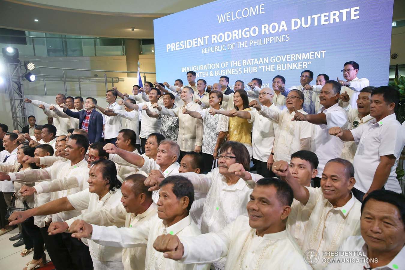 President Rodrigo Roa Duterte strikes his signature pose with the guests during the inauguration of the Bataan Government Center and Business Hub “The Bunker” in Balanga City, Bataan on September 12, 2019. ALBERT ALCAIN/PRESIDENTIAL PHOTO
