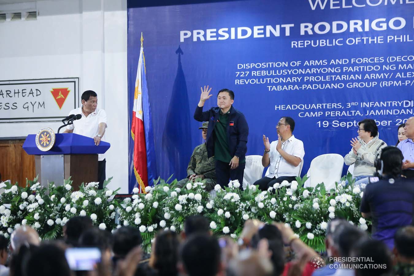 President Rodrigo Roa Duterte recognizes the presence of Senator Christopher "Bong" Go as he delivers his speech during the decommissioning of the arms and forces of the 727 Rebolusyonaryong Partido ng Manggagawa - Pilipinas/ Revolutionary Proletarian Army/ Alex Boncayao Brigade - Tabara-Paduano Group (RPM-P/RPA/ABB-TPG) at the Camp General Macario B. Peralta, Jr. in Jamindan, Capiz on September 19, 2019. ALFRED FRIAS/PRESIDENTIAL PHOTO