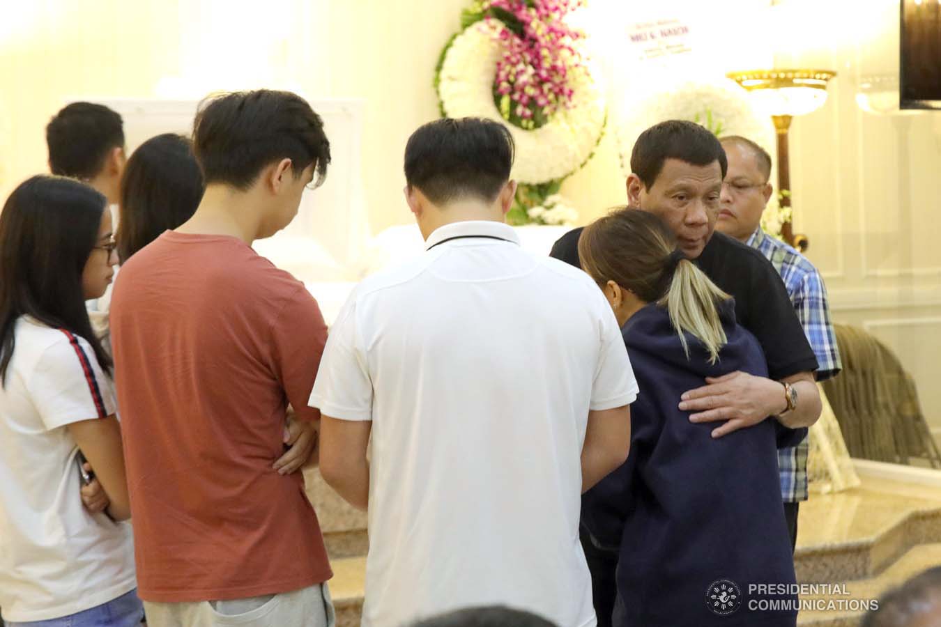 President Rodrigo Roa Duterte condoles with the family of Noli Ignacio as he visits the wake at the Cosmopolitan Funeral Homes in Davao City on September 21, 2019. ROBINSON NIÑAL JR./PRESIDENTIAL PHOTO
