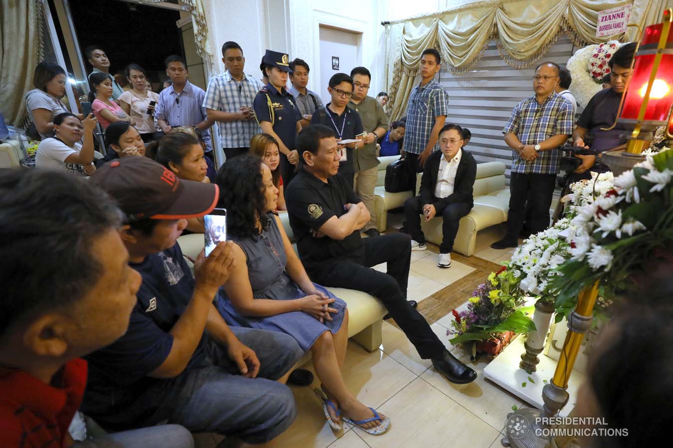 President Rodrigo Roa Duterte condoles with the family of Zianne Paraiso as he visits the wake at the Cosmopolitan Funeral Homes in Davao City on September 21, 2019. KARL NORMAN ALONZO/PRESIDENTIAL PHOTO
