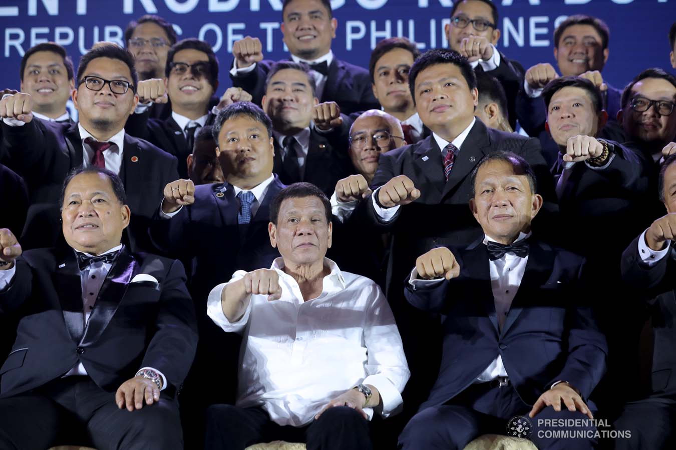 President Rodrigo Roa Duterte strikes his signature pose with the members of the Lex Talionis Fraternitas Inc. as they celebrate their 50th anniversary at The Manila Hotel on September 25, 2019. ALFRED FRIAS/PRESIDENTIAL PHOTO