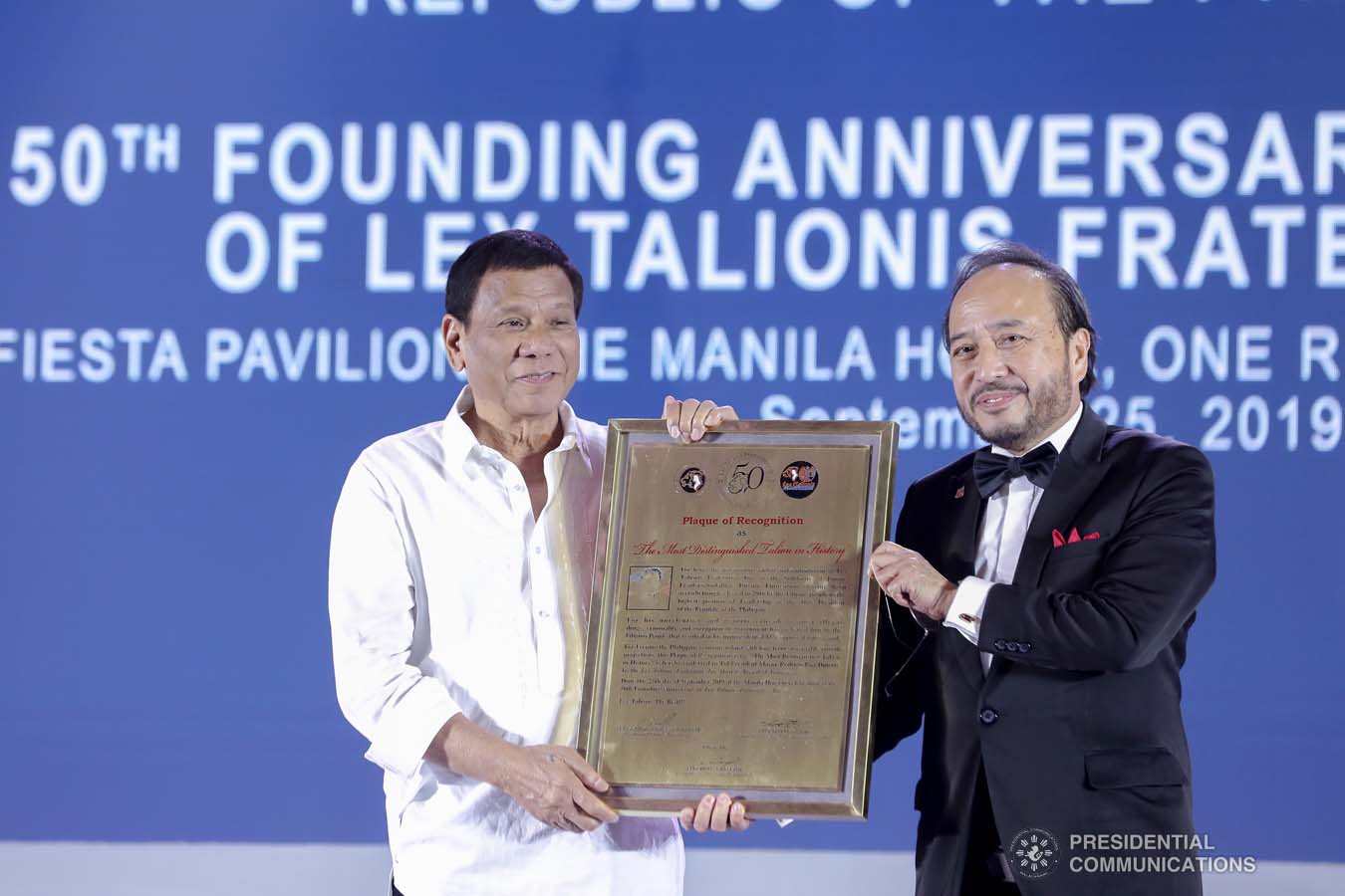 President Rodrigo Roa Duterte receives a plaque of recognition during the 50th Founding Anniversary Celebration of Lex Talionis Fraternitas Inc. at The Manila Hotel on September 25, 2019. ALFRED FRIAS/PRESIDENTIAL PHOTO