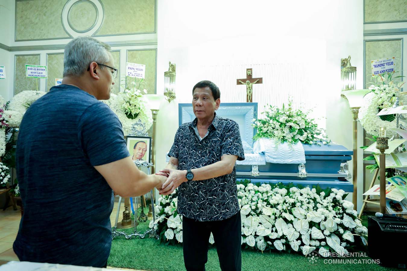 President Rodrigo Roa Duterte condoles with the family of Evelio Boiser as he visits the wake at the Cosmopolitan Funeral Homes in Davao City on September 26, 2019. KARL NORMAN ALONZO/PRESIDENTIAL PHOTO