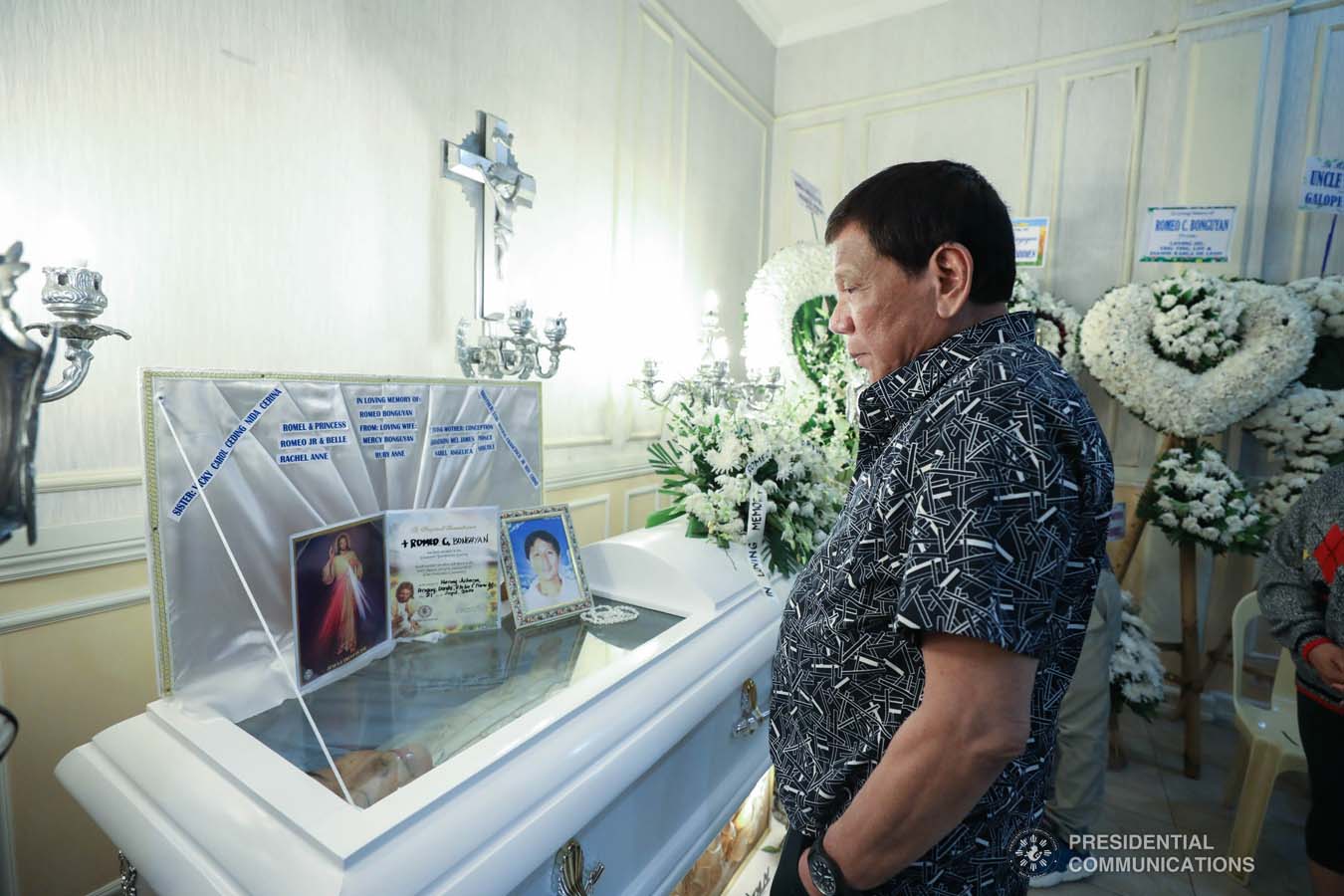 President Rodrigo Roa Duterte pays his last respects to Romeo Bonguyan as he visits the wake at the Cosmopolitan Funeral Homes in Davao City on September 26, 2019. KARL NORMAN ALONZO/PRESIDENTIAL PHOTO