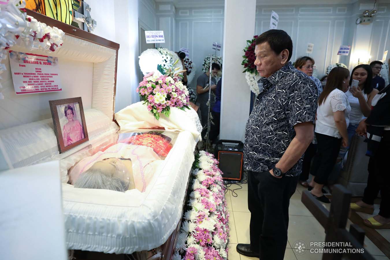 President Rodrigo Roa Duterte pays his last respects to Cresencia Josol as he visits the wake at the Cosmopolitan Funeral Homes in Davao City on September 26, 2019. RICHARD MADELO/PRESIDENTIAL PHOTO