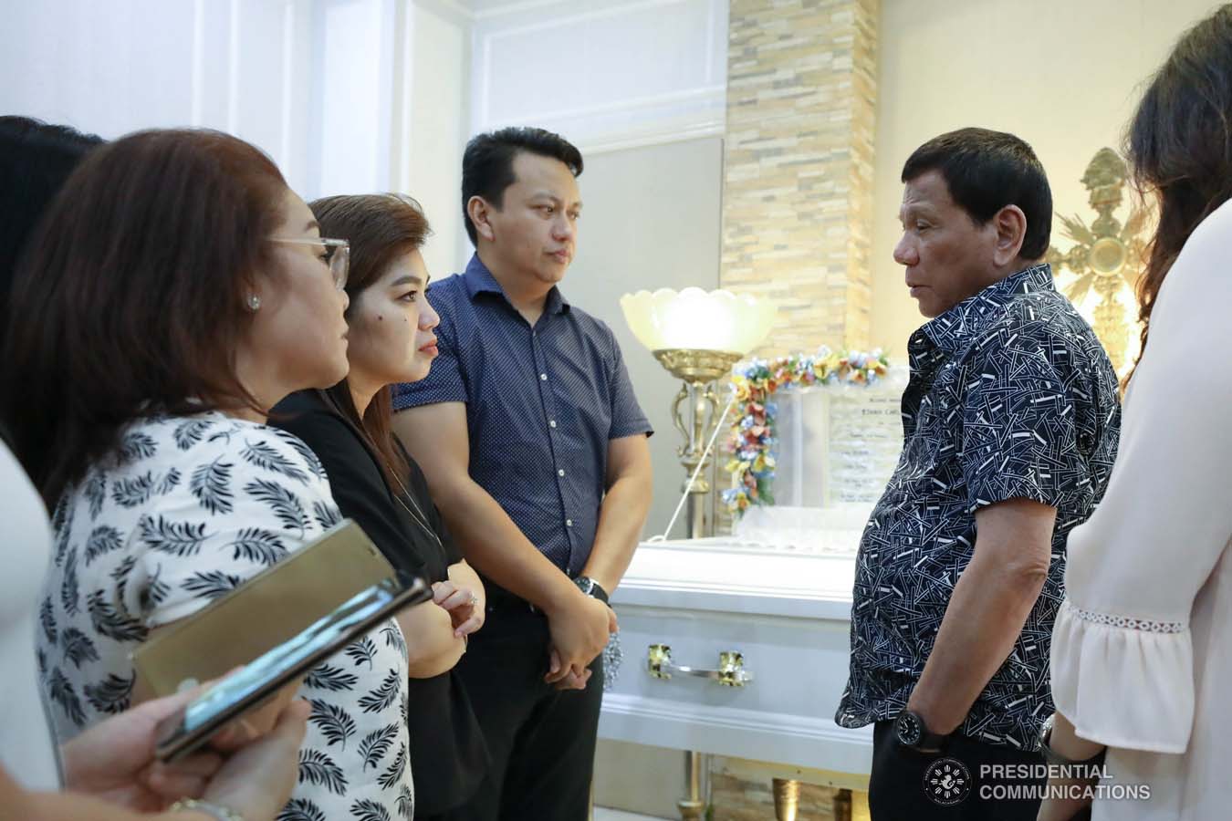 President Rodrigo Roa Duterte condoles with the family of Ethan Dabi as he visits the wake at the Cosmopolitan Funeral Homes in Davao City on September 26, 2019. RICHARD MADELO/PRESIDENTIAL PHOTO