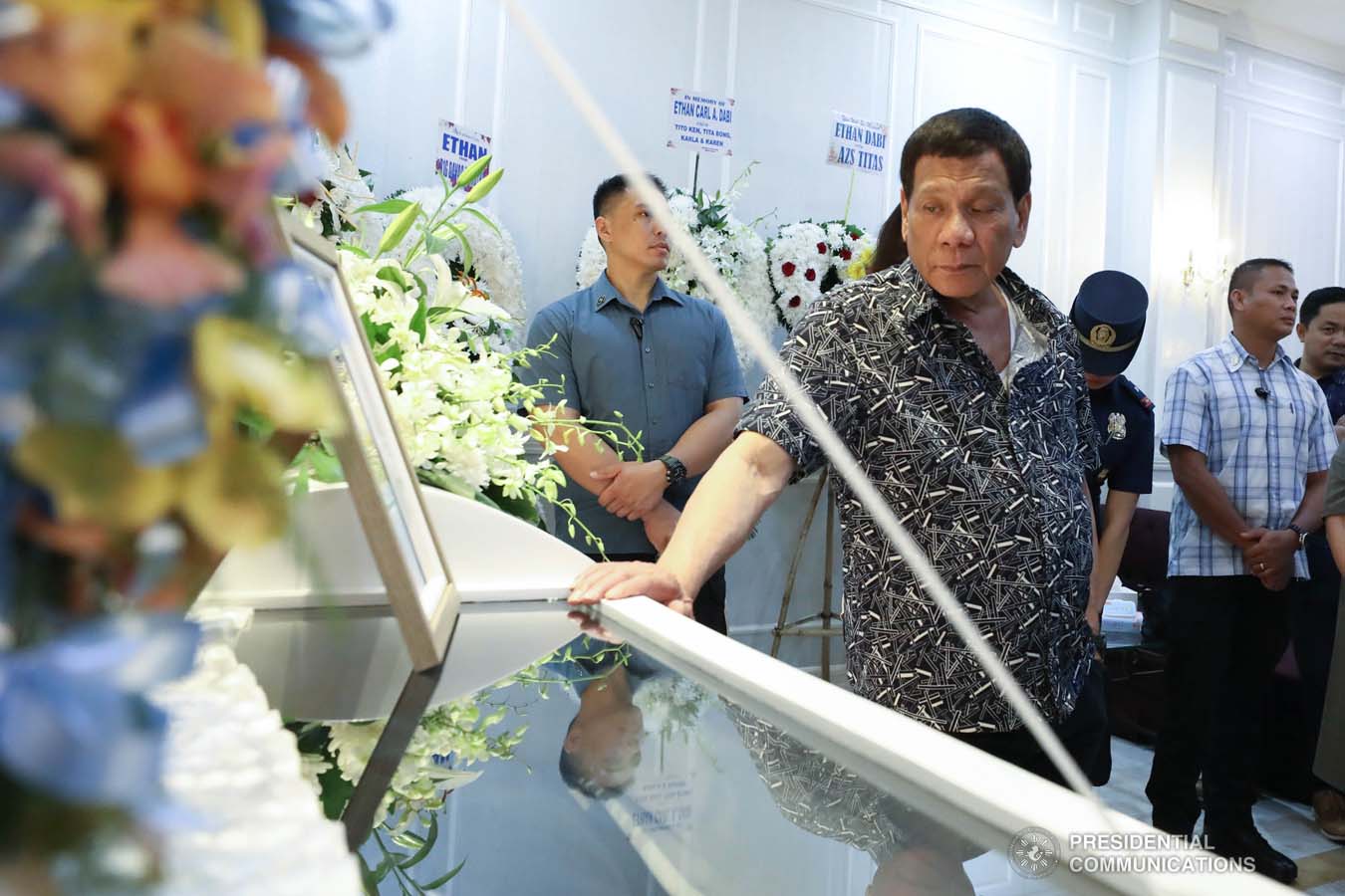 President Rodrigo Roa Duterte pays his last respects to Ethan Dabi as he visits the wake at the Cosmopolitan Funeral Homes in Davao City on September 26, 2019. RICHARD MADELO/PRESIDENTIAL PHOTO