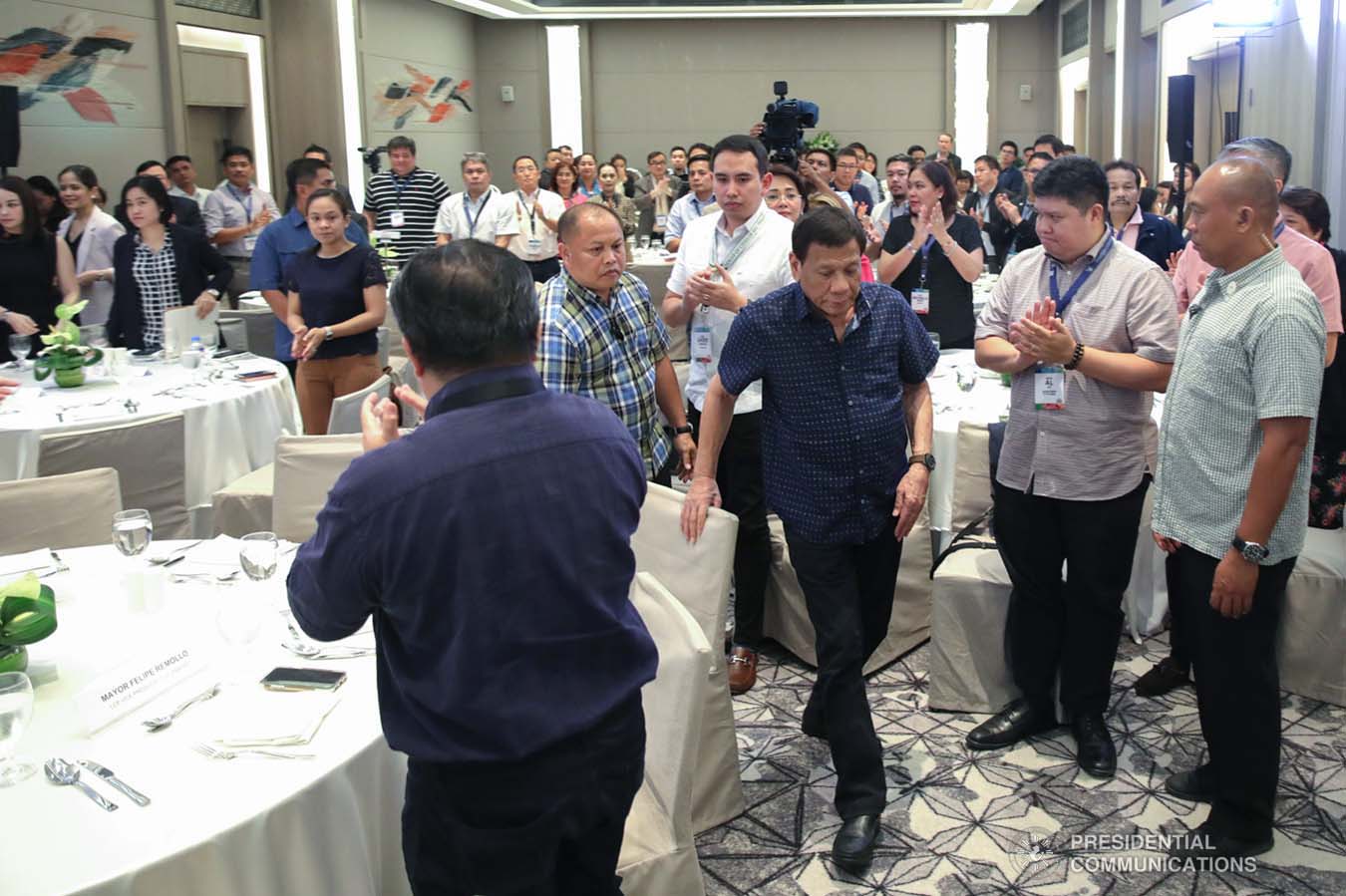 President Rodrigo Roa Duterte heads over to the stage to deliver his speech during the 69th National Executive Board Meeting of the League of Cities of the Philippines at the DusitD2 Davao Hotel in Davao City on September 27, 2019. ROBINSON NIÑAL JR./PRESIDENTIAL PHOTO