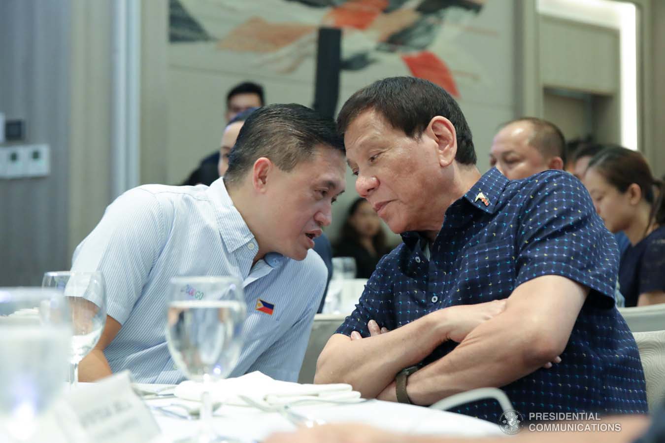 President Rodrigo Roa Duterte chats with Senator Christopher "Bong" Go on the sidelines of the 69th National Executive Board Meeting of the League of Cities of the Philippines at the DusitD2 Davao Hotel in Davao City on September 27, 2019. ROBINSON NIÑAL JR./PRESIDENTIAL PHOTO