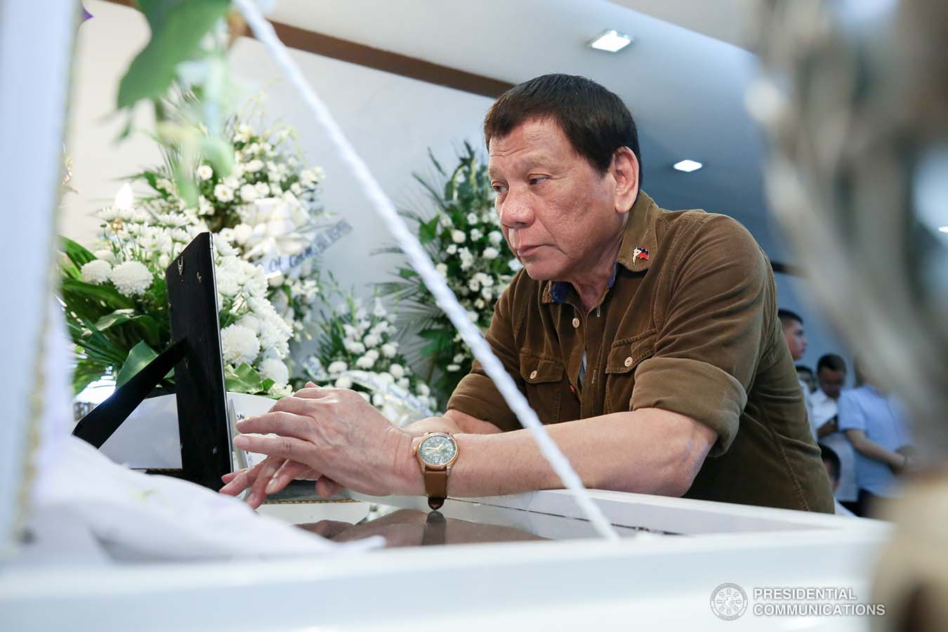President Rodrigo Roa Duterte pays his last respects to Engr. Salvador M. Lecaros as he visits the wake at St. Peter Memorial Chapel in Cebu City on September 6, 2019. ALBERT ALCAIN/ PRESIDENTIAL PHOTO