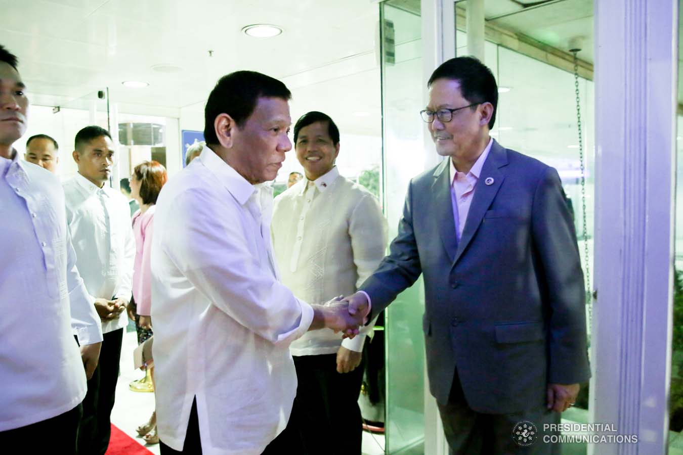 President Rodrigo Roa Duterte bids farewell to Justice Secretary Menardo Guevarra prior to his departure at the Ninoy Aquino International Airport in Pasay City on October 01, 2019 for his official visit to the Russian Federation. ALBERT ALCAIN/PRESIDENTIAL PHOTO