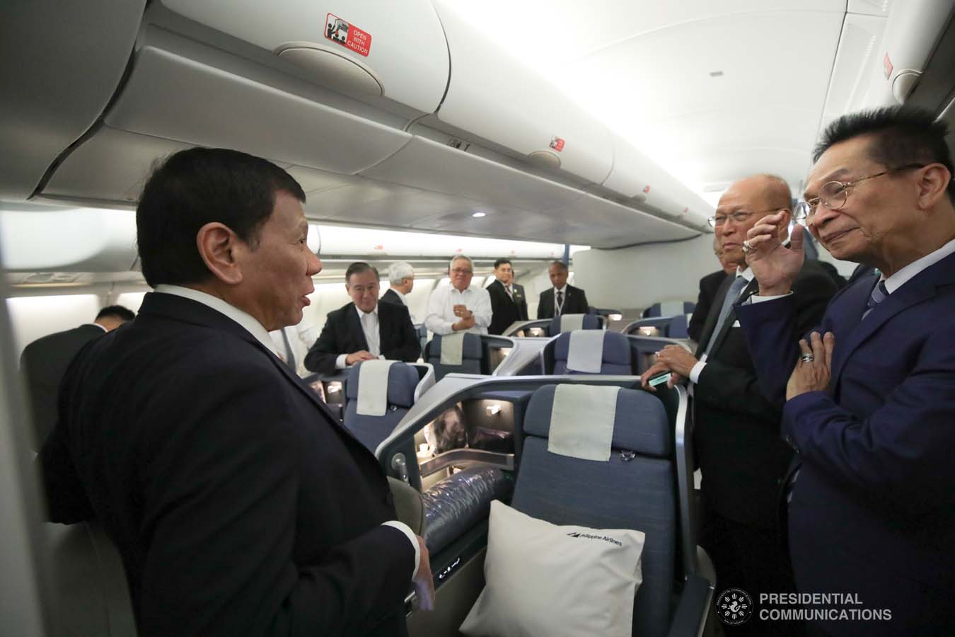 President Rodrigo Roa Duterte chats with the members of his delegation while on board a plane back to Moscow, Russia following his successful engagements in Sochi on October 3, 2019. KING RODRIGUEZ/PRESIDENTIAL PHOTO