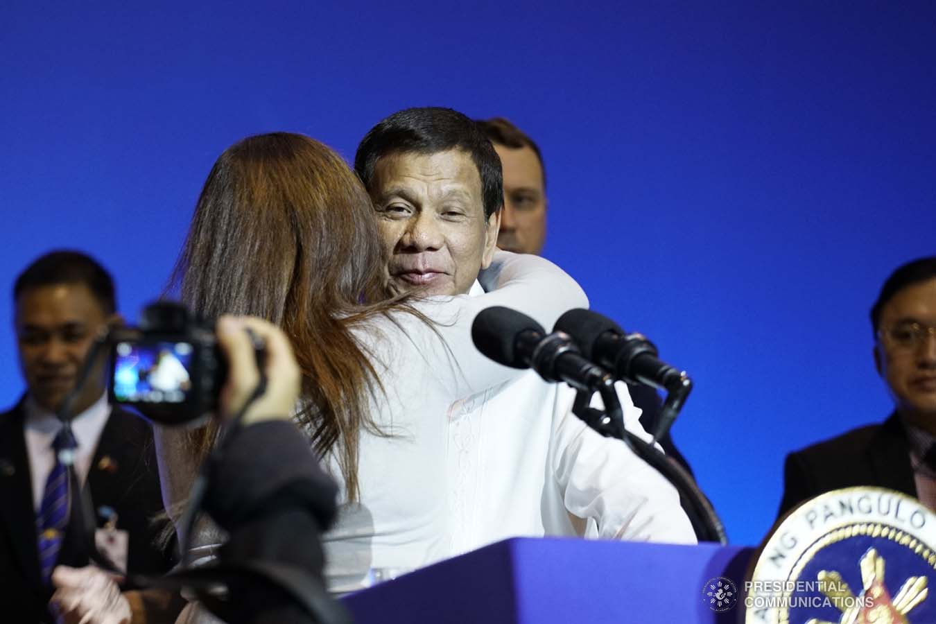 President Rodrigo Roa Duterte is embraced by one of the Filipinos based in Russia who met with the President at the Exhibition of Achievements of National Economy (VDNH) in Moscow on October 5, 2019. KING RODRIGUEZ/PRESIDENTIAL PHOTO