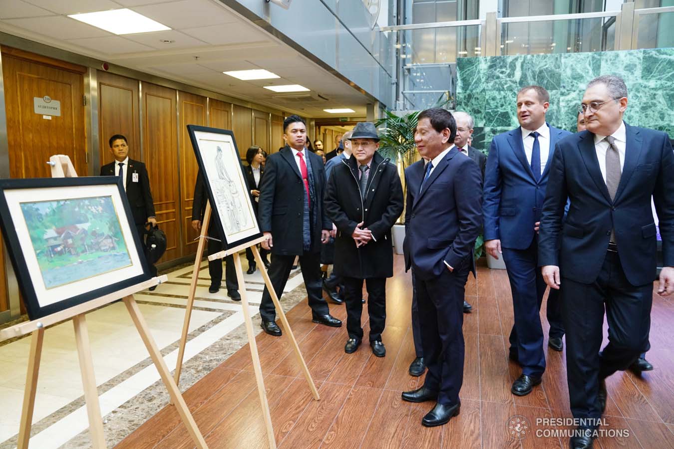 President Rodrigo Roa Duterte admires the artwork displayed during the ASEAN-Russian Exhibition at the Moscow State Institute of International Relations (MGIMO) University in Moscow, Russian Federation on October 05, 2019. JOEY DALUMPINES/PRESIDENTIAL PHOTO