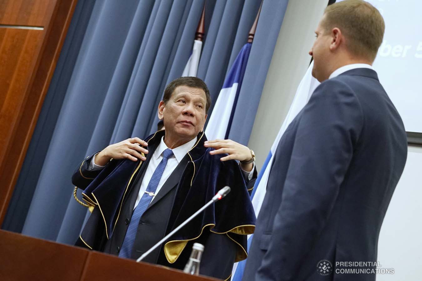 President Rodrigo Roa Duterte dons the robe and toga after receiving an honorary doctorate degree diploma from Moscow State Institute of International Relations (MGIMO) University Vice Rector Artem Malgin during a ceremony at the MGIMO University in Moscow, Russian Federation on October 05, 2019. KING RODRIGUEZ/PRESIDENTIAL PHOTO