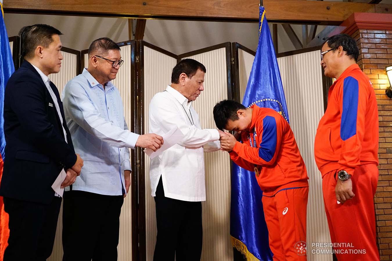 President Rodrigo Roa Duterte is given a gesture of respect by 2019 AIBA Women's World Boxing Championships Gold Medalist Nesthy Petecio during their meeting at the Malago Clubhouse in Malacañang on October 16, 2019. KING RODRIGUEZ/PRESIDENTIAL PHOTO