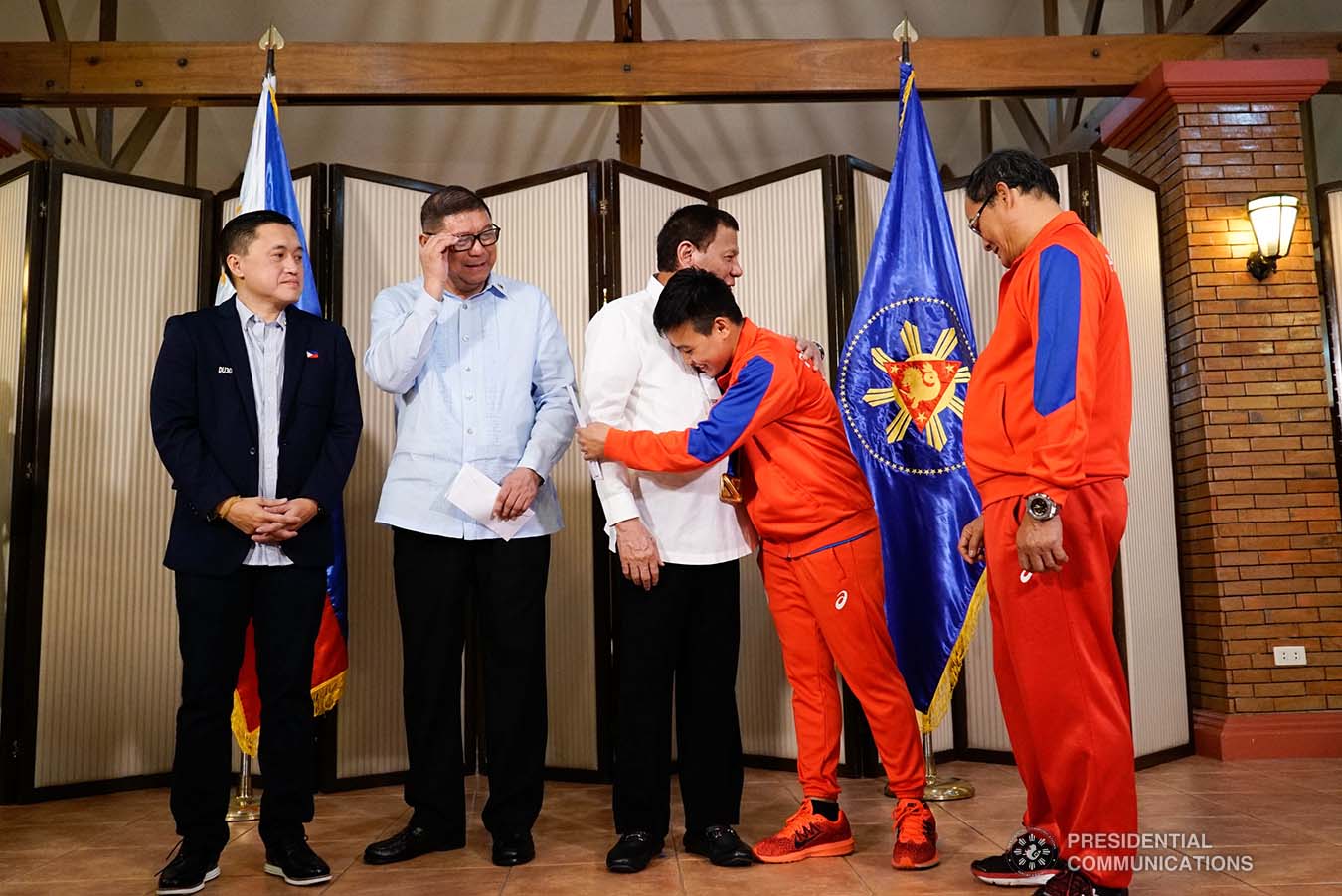 President Rodrigo Roa Duterte is embraced by 2019 AIBA Women's World Boxing Championships Gold Medalist Nesthy Petecio during their meeting at the Malago Clubhouse in Malacañang on October 16, 2019. KING RODRIGUEZ/PRESIDENTIAL PHOTO