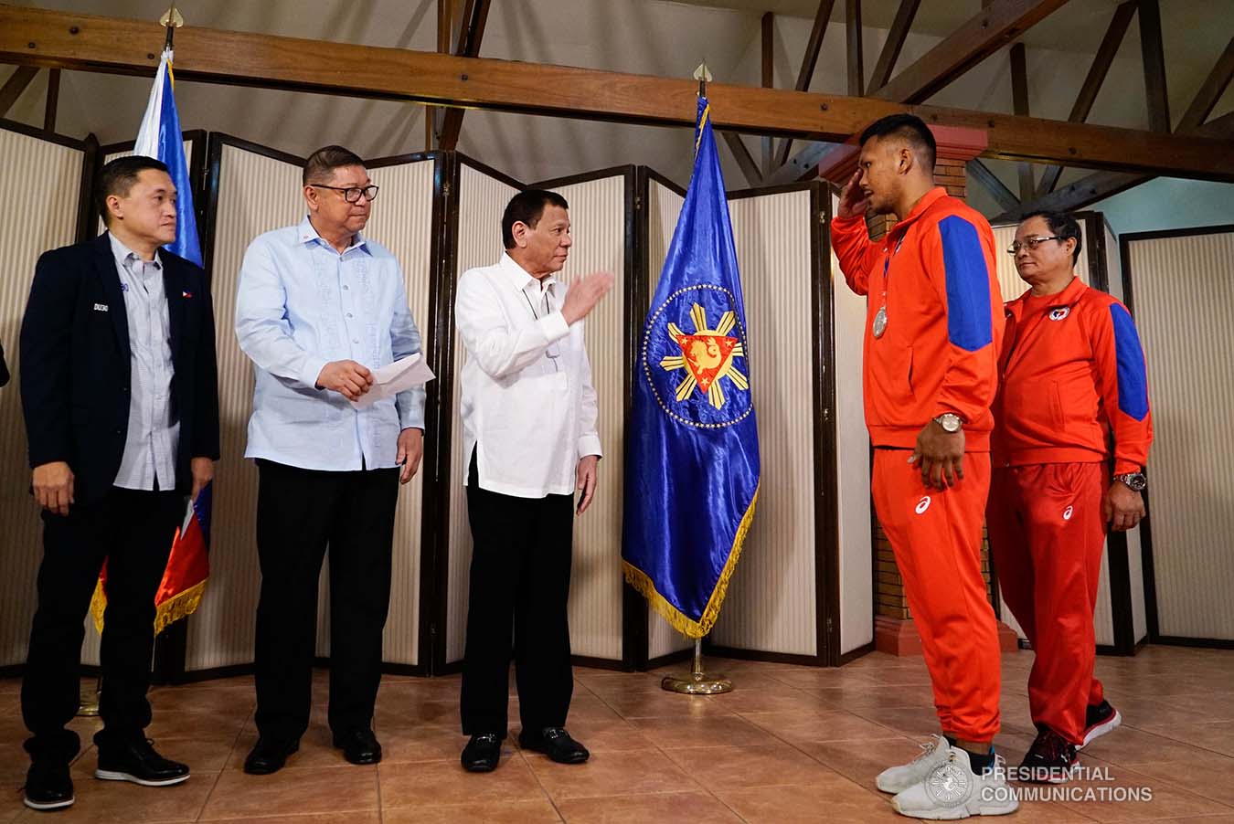 President Rodrigo Roa Duterte salutes 2019 AIBA Men's World Boxing Championships Silver Medalist Eumir Marcial during their meeting at the Malago Clubhouse in Malacañang on October 16, 2019. KING RODRIGUEZ/PRESIDENTIAL PHOTO