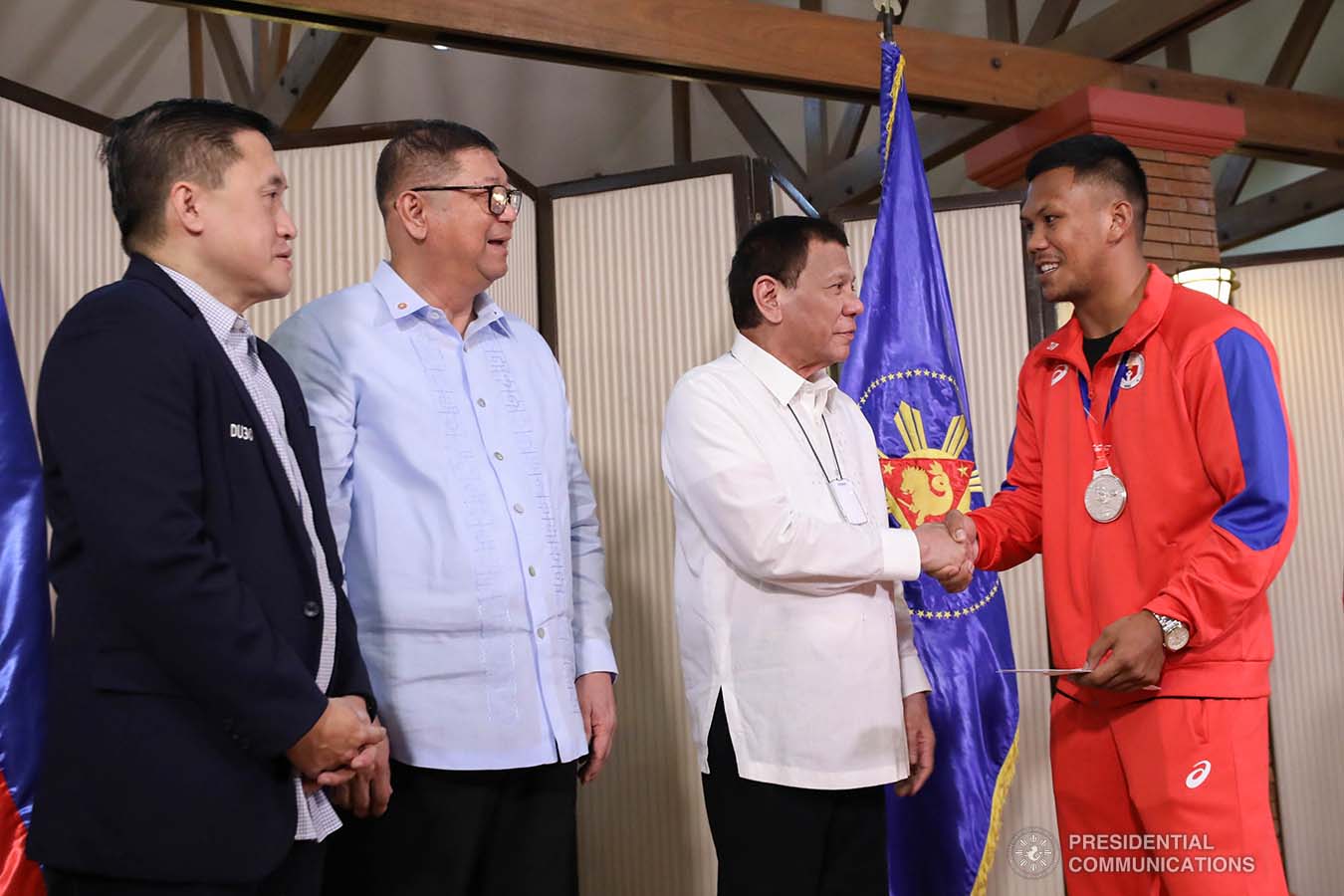 President Rodrigo Roa Duterte salutes 2019 AIBA Men's World Boxing Championships Silver Medalist Eumir Marcial during their meeting at the Malago Clubhouse in Malacañang on October 16, 2019. RICHARD MADELO/PRESIDENTIAL PHOTO