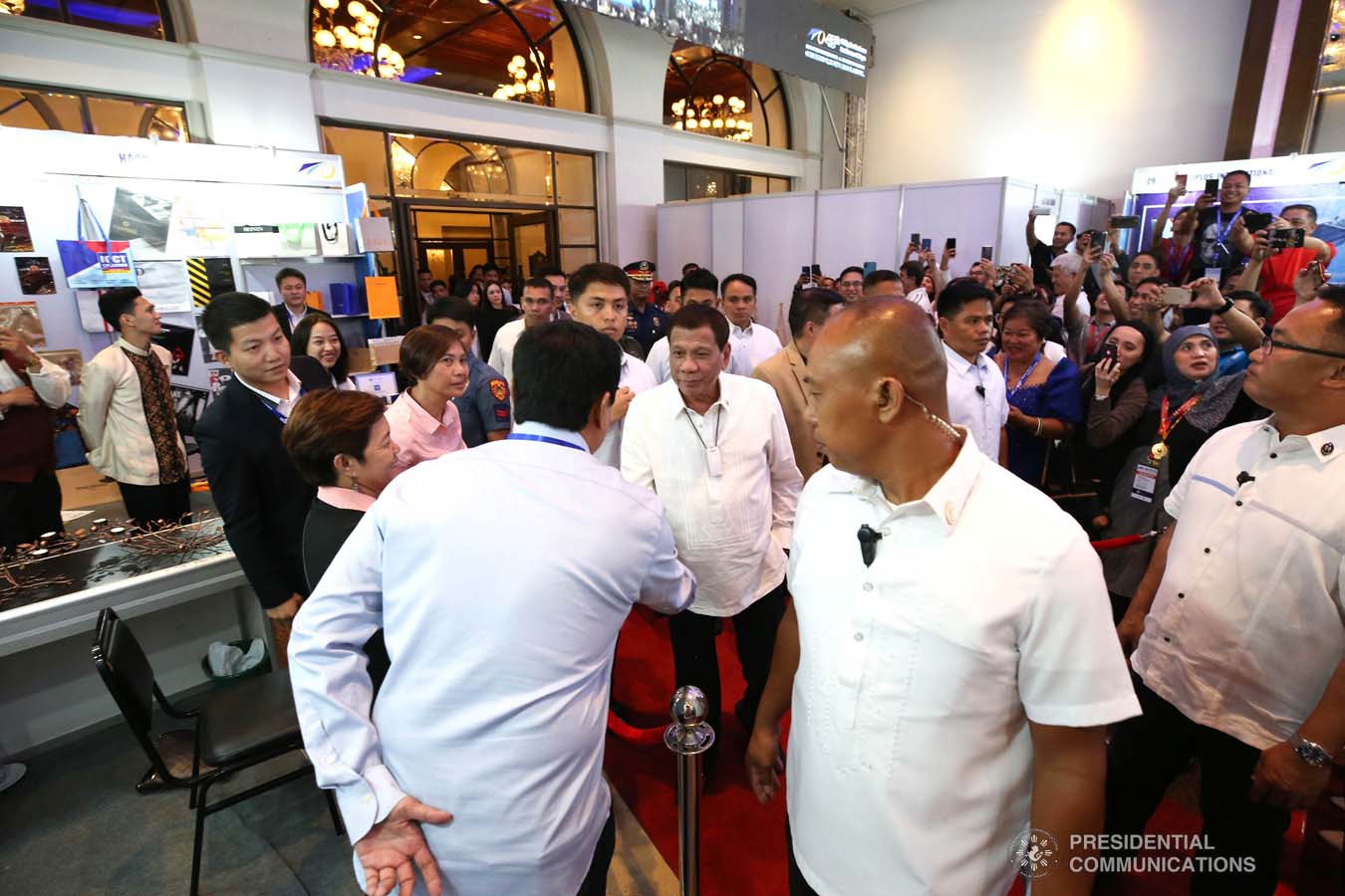 President Rodrigo Roa Duterte is greeted by one of the guests as he inspects the booths during the 45th Philippine Business Conference and Expo at The Manila Hotel on October 17, 2019. ROBINSON NIÑAL JR./PRESIDENTIAL PHOTO