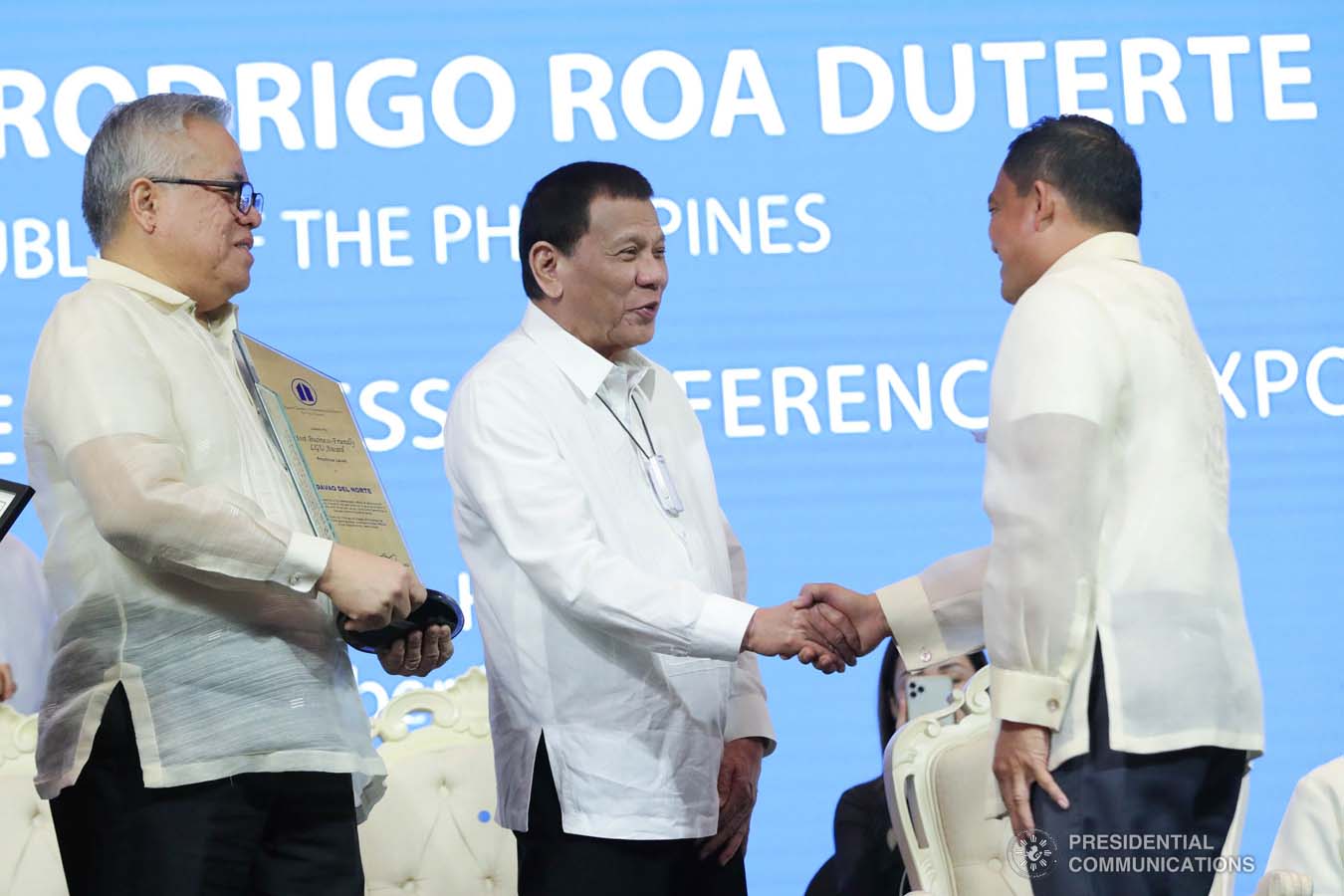 President Rodrigo Roa Duterte congratulates Davao del Norte Governor Edwin Jubahib as he receives the Most Business-Friendly LGU Provincial Level Award during the 45th Philippine Business Conference and Expo at The Manila Hotel on October 17, 2019. Assisting the President during the awarding ceremony is Trade and Industry Secretary Ramon Lopez. ROBINSON NIÑAL JR./PRESIDENTIAL PHOTO