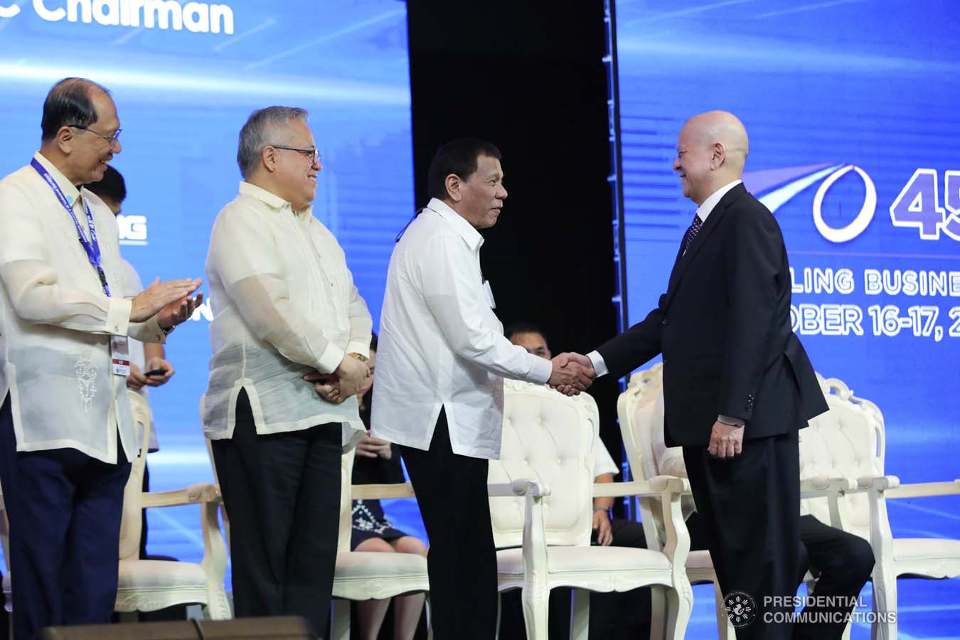 President Rodrigo Roa Duterte congratulates 44th Philippine Business Conference and Expo (PBC & E) Chairman Ramon Ang who was recognized for organizing the past PBC & E during the 45th PBC & E at The Manila Hotel on October 17, 2019. Assisting the President during the awarding ceremony is Trade and Industry Secretary Ramon Lopez. ROBINSON NIÑAL JR./PRESIDENTIAL PHOTO