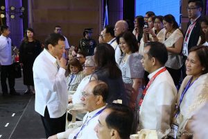 President Rodrigo Roa Duterte shares a light moment with some of the guests during the 45th Philippine Business Conference and Expo at The Manila Hotel on October 17, 2019. ROBINSON NIÑAL JR./PRESIDENTIAL PHOTO