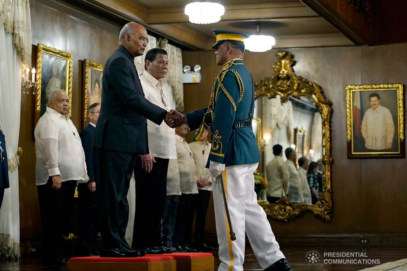 President Rodrigo Roa Duterte looks on as President of the Republic of India Ram Nath Kovind greets the commander of the honor guards upon his arrival at the Malacañan Palace on October 18, 2019. President Kovind is on a five-day state visit to the Philippines. KING RODRIGUEZ/PRESIDENTIAL PHOTO