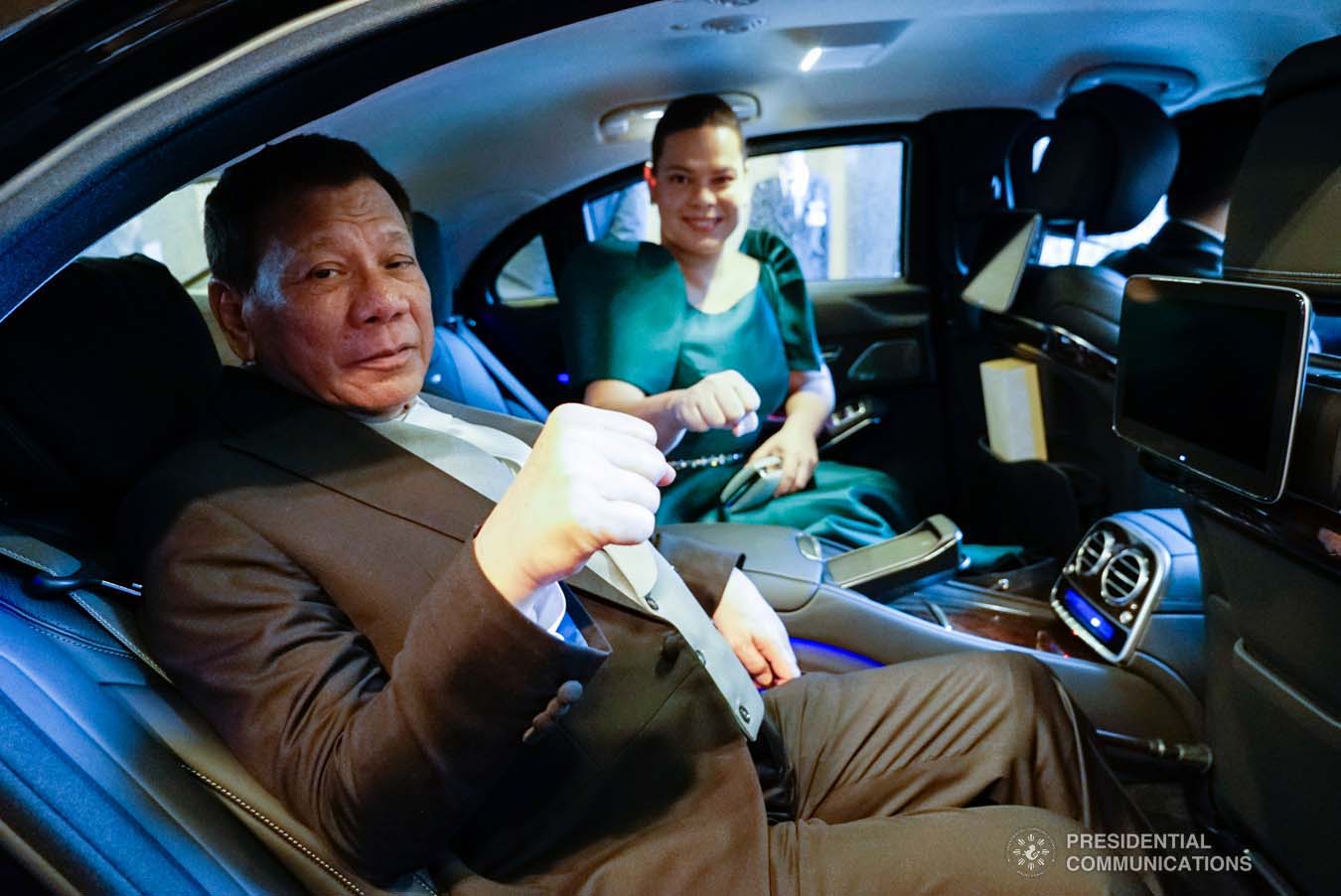 President Rodrigo Roa Duterte strikes his signature pose with his daughter, Davao City Mayor Sara Duterte-Carpio, as they prepare to head to the Imperial Palace in Tokyo, Japan for the Ceremonies of the Accession to the Throne of His Majesty Emperor Naruhito on October 22, 2019. KING RODRIGUEZ/PRESIDENTIAL PHOTO
