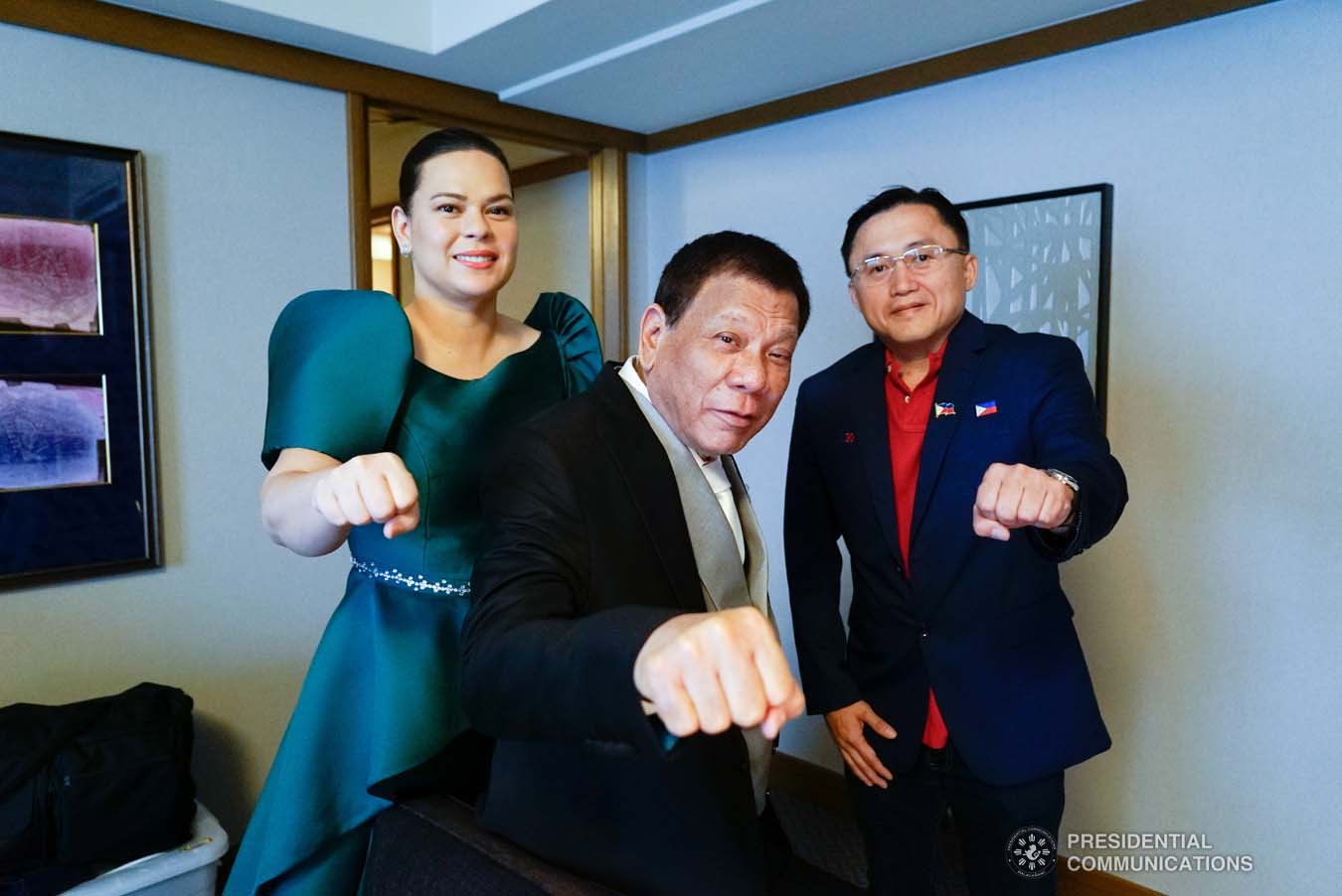 President Rodrigo Roa Duterte strikes his signature pose with his daughter, Davao City Mayor Sara Duterte-Carpio, and Senator Christopher "Bong" Go as they prepare for the Ceremonies of the Accession to the Throne of His Majesty Emperor Naruhito while at a hotel in Tokyo, Japan on October 22, 2019. KING RODRIGUEZ/PRESIDENTIAL PHOTO