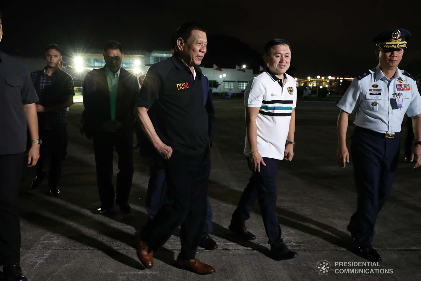 President Rodrigo Roa Duterte shares a light moment with Senator Christopher "Bong" Go upon his arrival at the Villamor Air Base in Pasay City on November 4, 2019 following his successful participation in the 35th Association of Southeast Asian Nations (ASEAN) Summit and Related Summits in the Kingdom of Thailand. ROBINSON NIÑAL JR./PRESIDENTIAL PHOTO