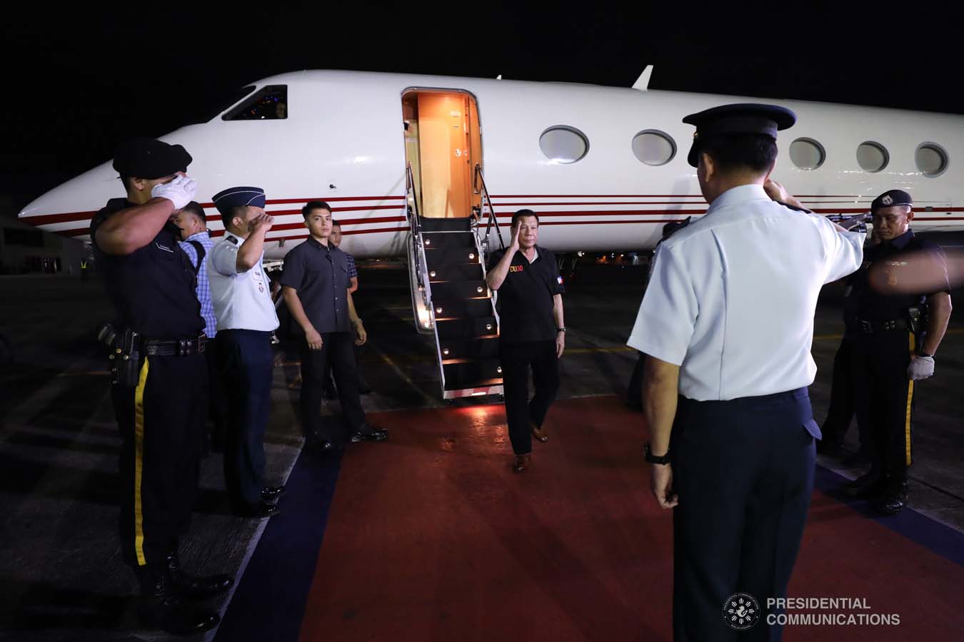President Rodrigo Roa Duterte salutes an officer from the Philippine Air Force upon his arrival at the Villamor Air Base in Pasay City on November 4, 2019 following his successful participation in the 35th Association of Southeast Asian Nations (ASEAN) Summit and Related Summits in the Kingdom of Thailand. ROBINSON NIÑAL JR./PRESIDENTIAL PHOTO