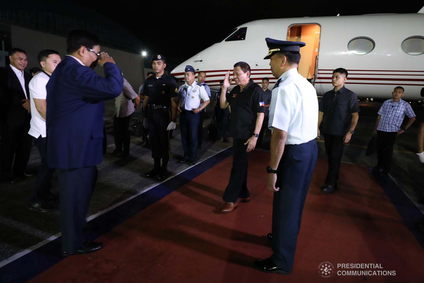 President Rodrigo Roa Duterte salutes National Security Adviser Hermogenes Esperon Jr. upon his arrival at the Villamor Air Base in Pasay City on November 4, 2019 following his successful participation in the 35th Association of Southeast Asian Nations (ASEAN) Summit and Related Summits in the Kingdom of Thailand. ROBINSON NIÑAL JR./PRESIDENTIAL PHOTO