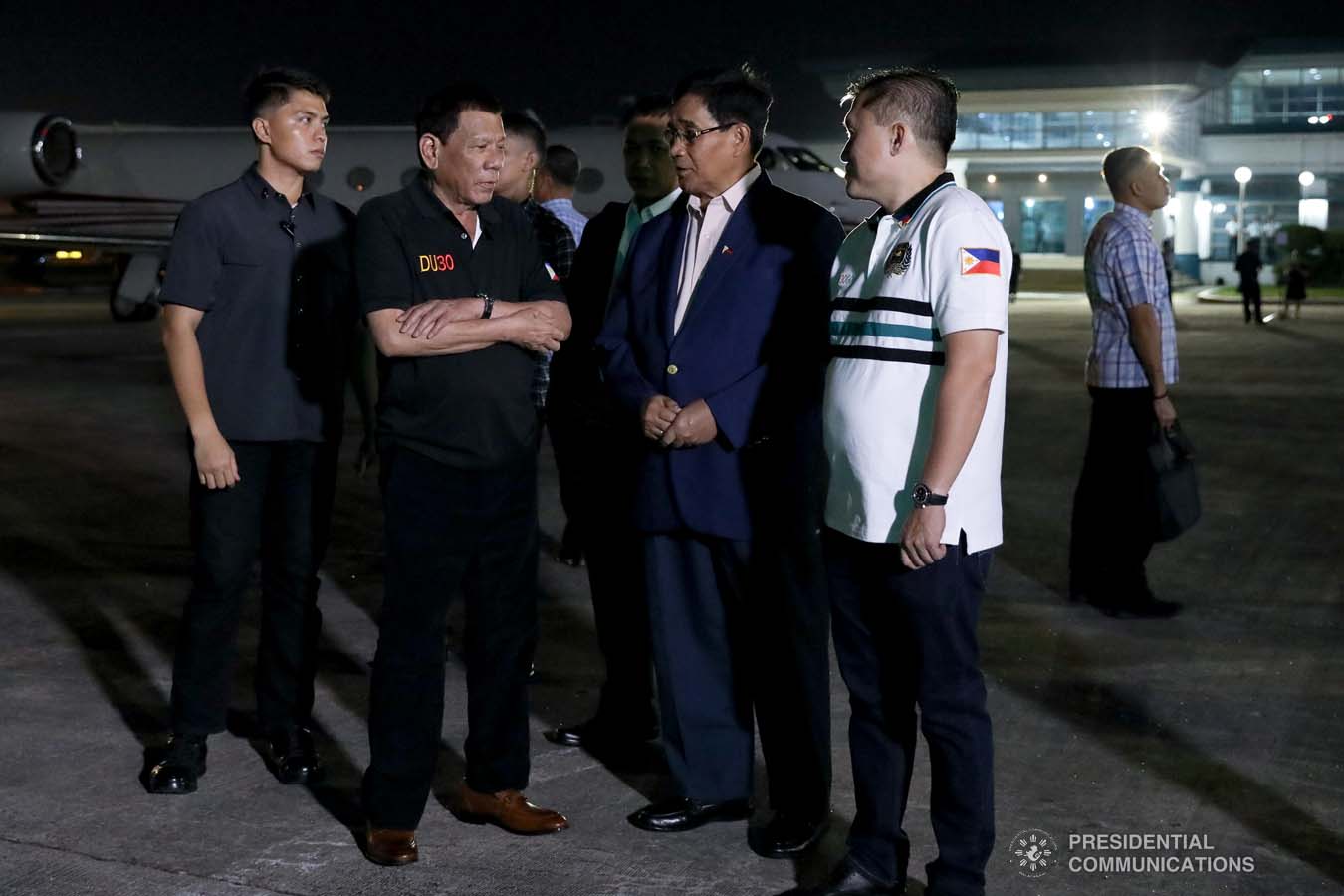 President Rodrigo Roa Duterte discusses matters with National Security Adviser Hermogenes Esperon Jr. and Senator Christopher "Bong" Go upon his arrival at the Villamor Air Base in Pasay City on November 4, 2019 following his successful participation in the 35th Association of Southeast Asian Nations (ASEAN) Summit and Related Summits in the Kingdom of Thailand. KARL NORMAN ALONZO/PRESIDENTIAL PHOTO