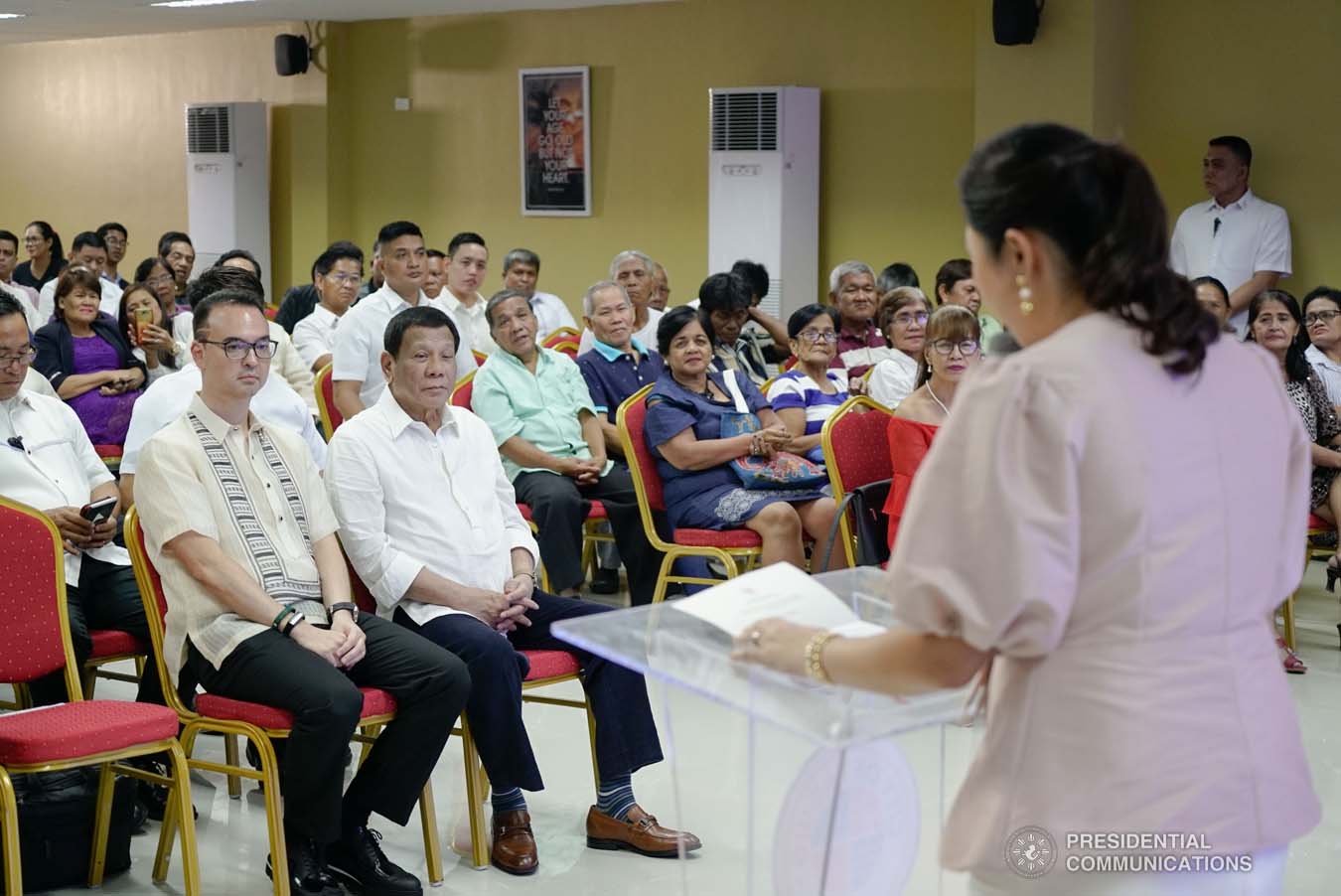 President Rodrigo Roa Duterte listens to the message of Taguig City Second District Representative Maria Laarni Cayetano during the President's visit to the Taguig City Center for the Elderly on November 21, 2019. KING RODRIGUEZ/PRESIDENTIAL PHOTO